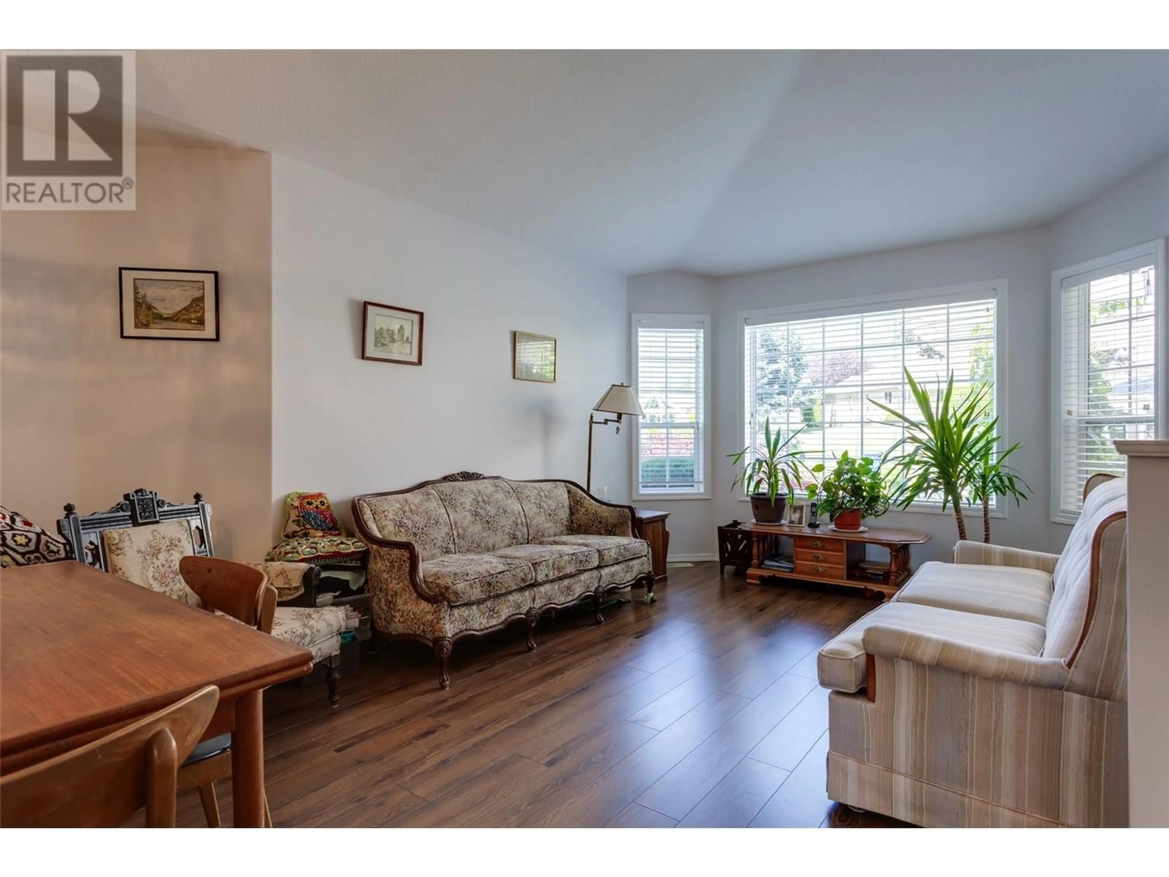 Living room with furniture, wood/laminate floor for 102 - 2250 LOUIE DRIVE, Westbank British Columbia V4T2M6