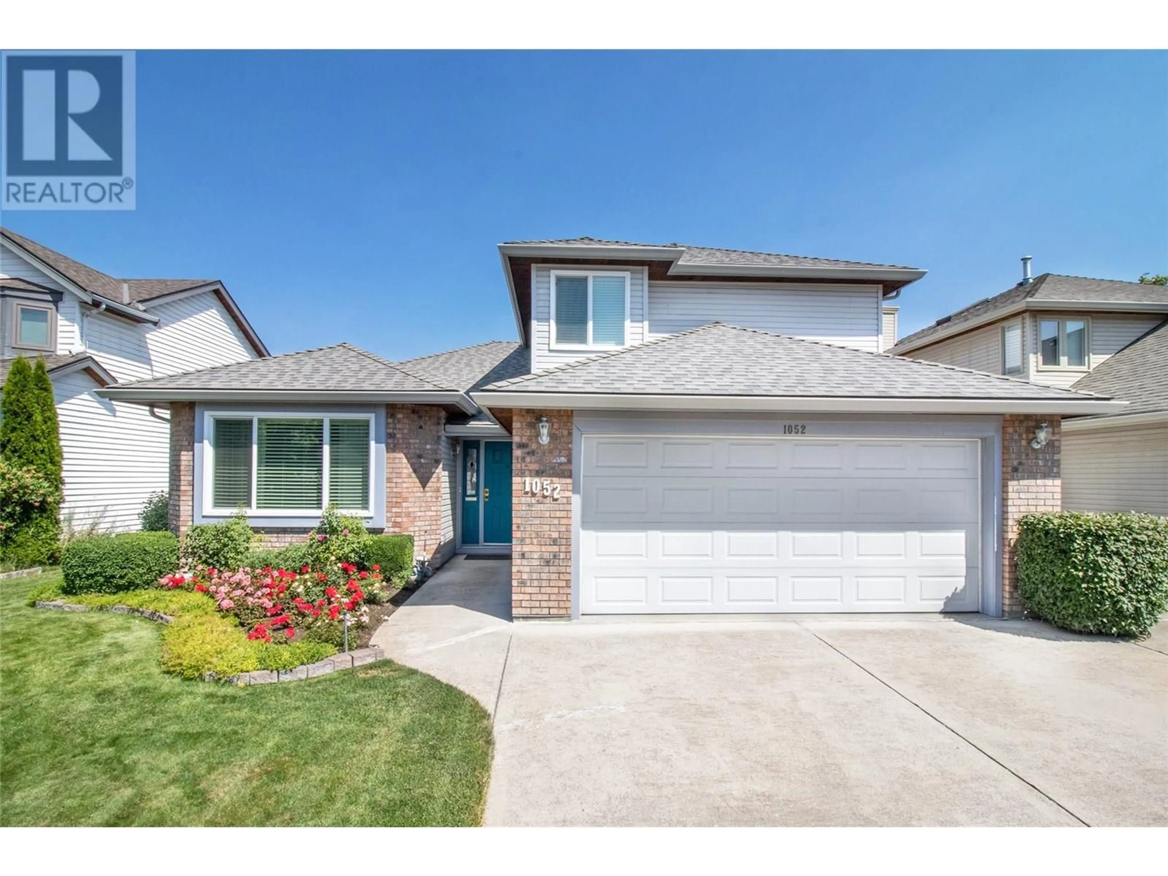 Home with brick exterior material, street for 1052 WINTERGREEN DRIVE, Kelowna British Columbia V1W3V7
