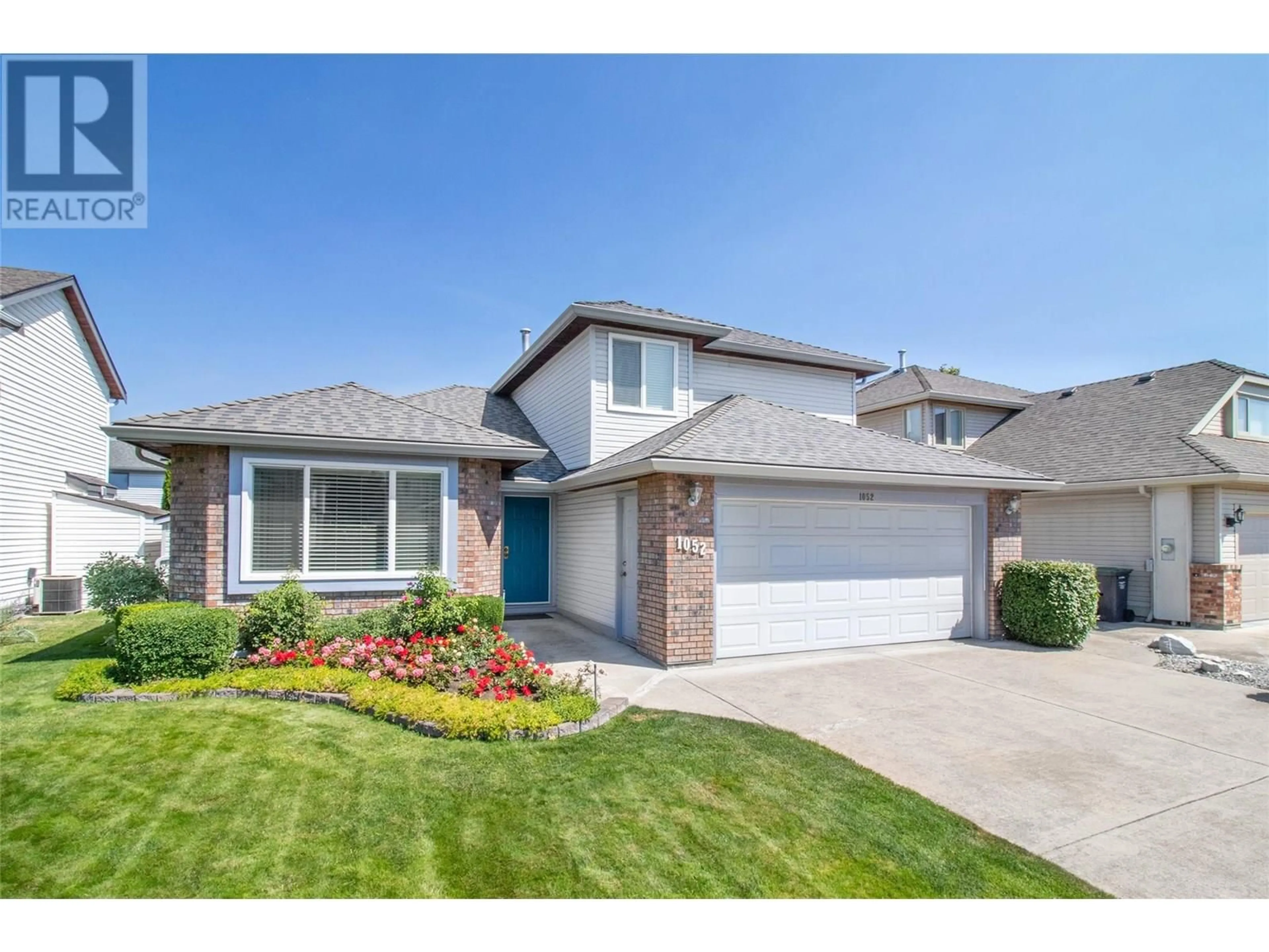 Home with brick exterior material, street for 1052 WINTERGREEN DRIVE, Kelowna British Columbia V1W3V7