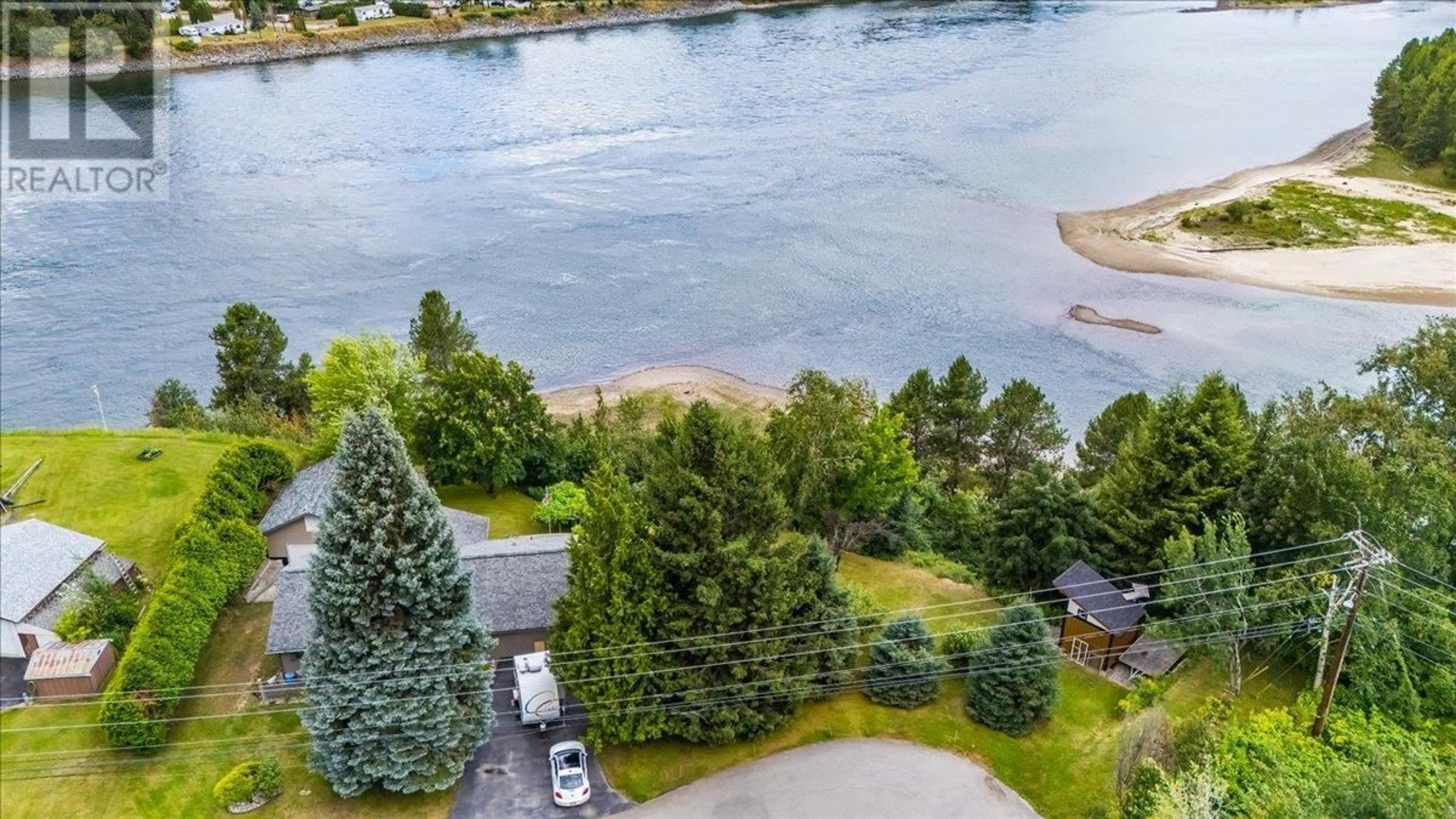 A pic from outside/outdoor area/front of a property/back of a property/a pic from drone, water/lake/river/ocean view for 1986 BRILLIANT ROAD, Castlegar British Columbia V1N4M2