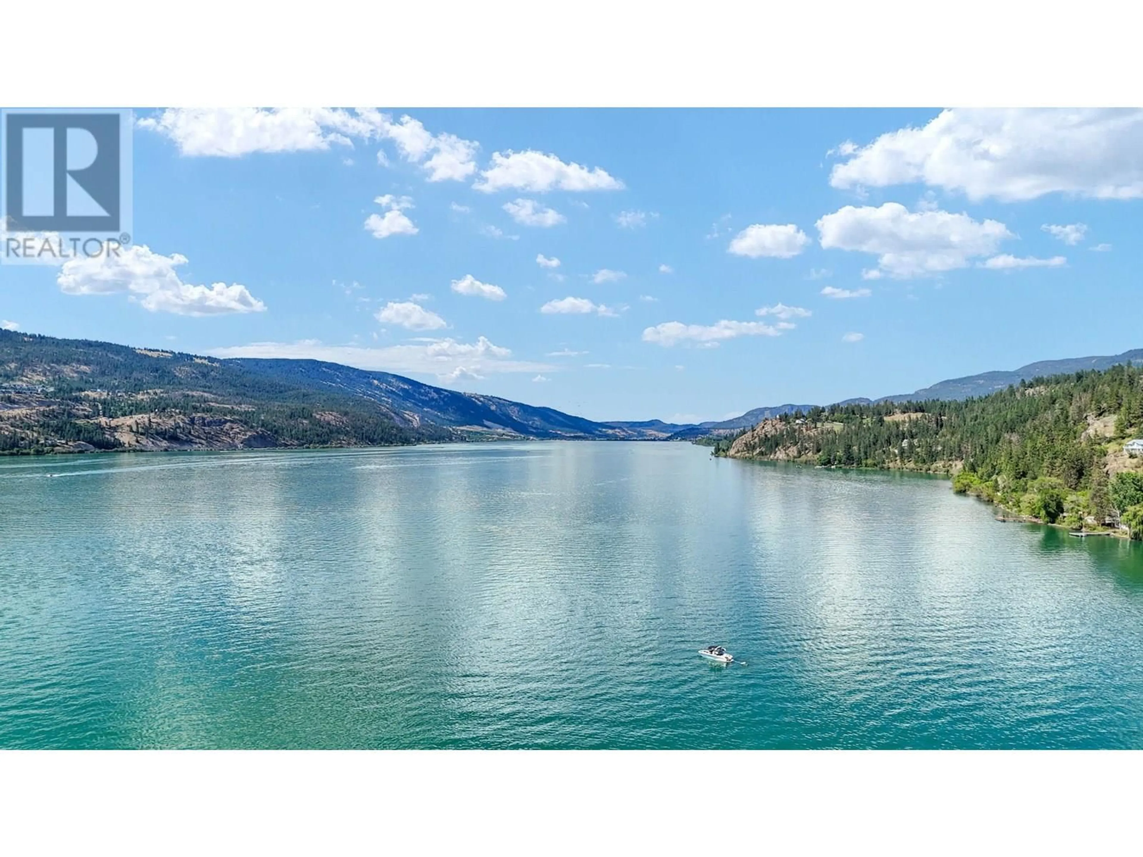 A pic from outside/outdoor area/front of a property/back of a property/a pic from drone, water/lake/river/ocean view for 303 - 3570 WOODSDALE ROAD, Lake Country British Columbia V4V1Y9