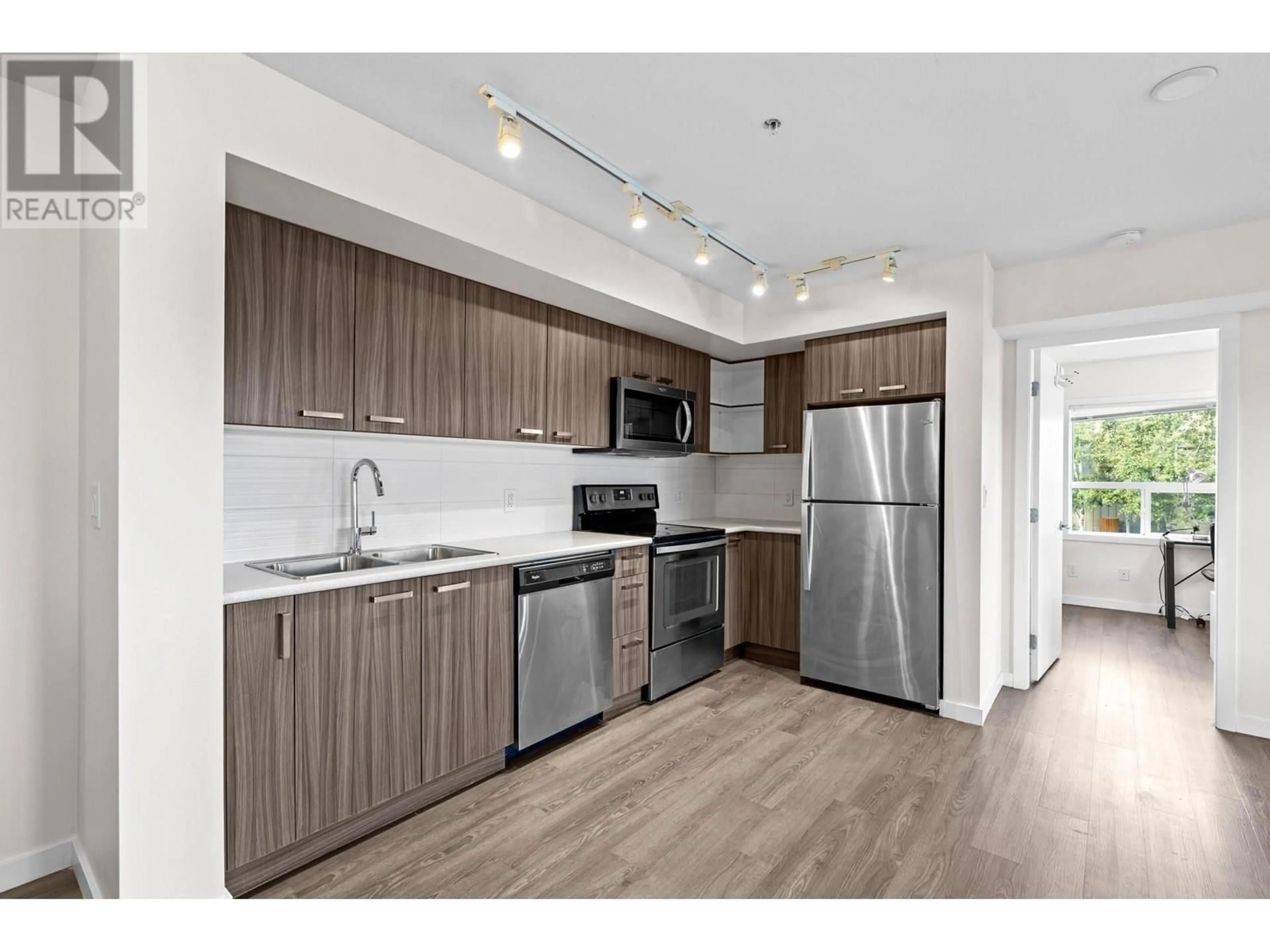 Standard kitchen, wood/laminate floor for 107 - 775 ACADEMY WAY, Kelowna British Columbia V4C2C6
