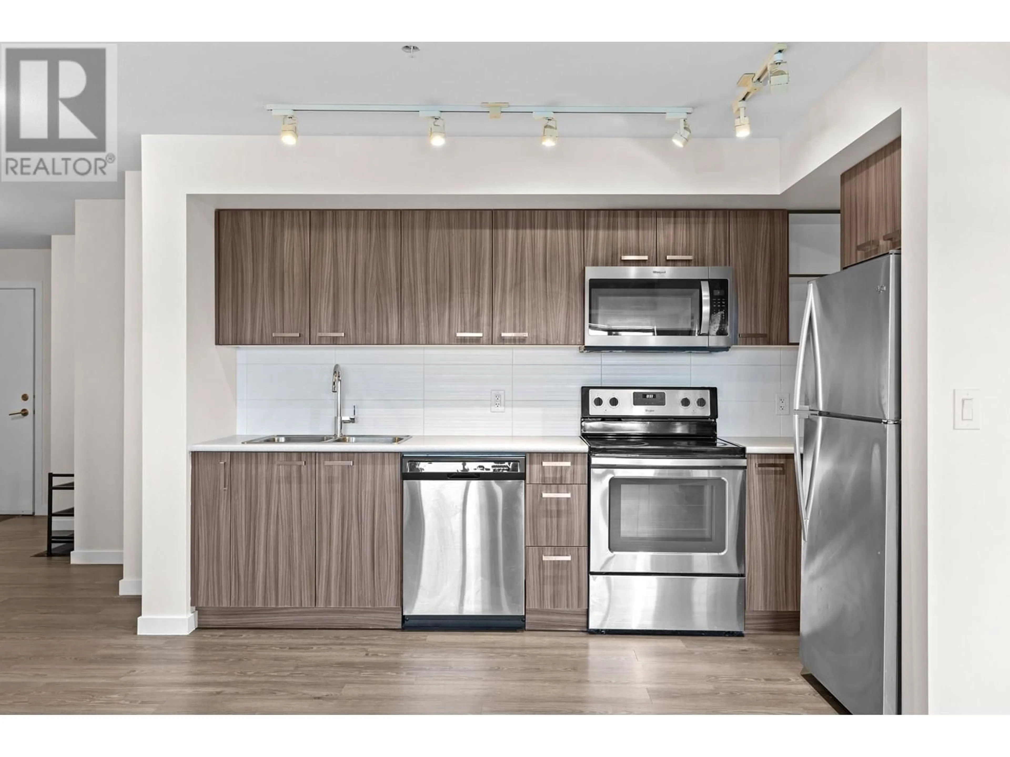 Standard kitchen, wood/laminate floor for 107 - 775 ACADEMY WAY, Kelowna British Columbia V4C2C6