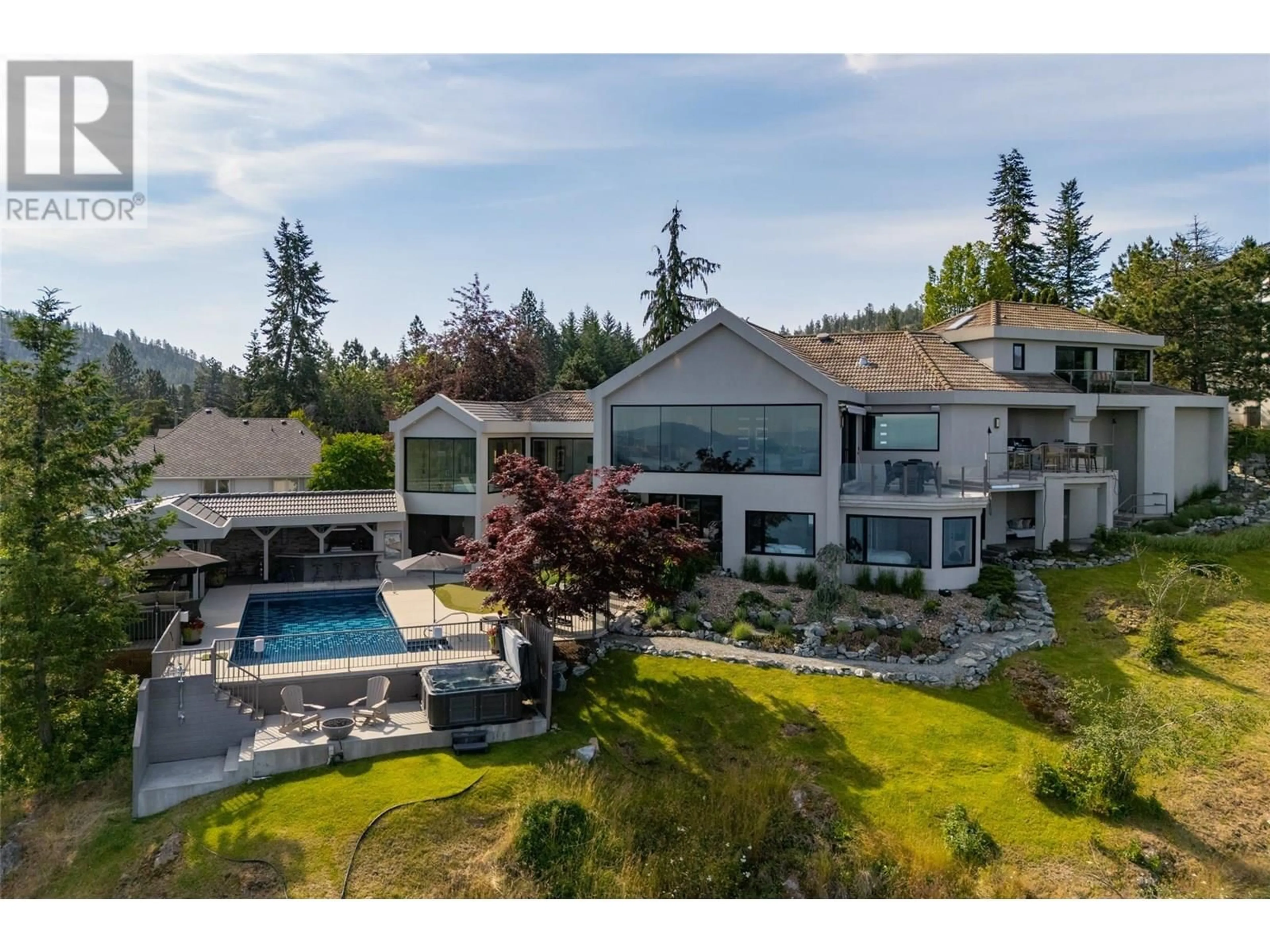 A pic from outside/outdoor area/front of a property/back of a property/a pic from drone, mountain view for 228 CALIBURN COURT, Kelowna British Columbia V1V1N2