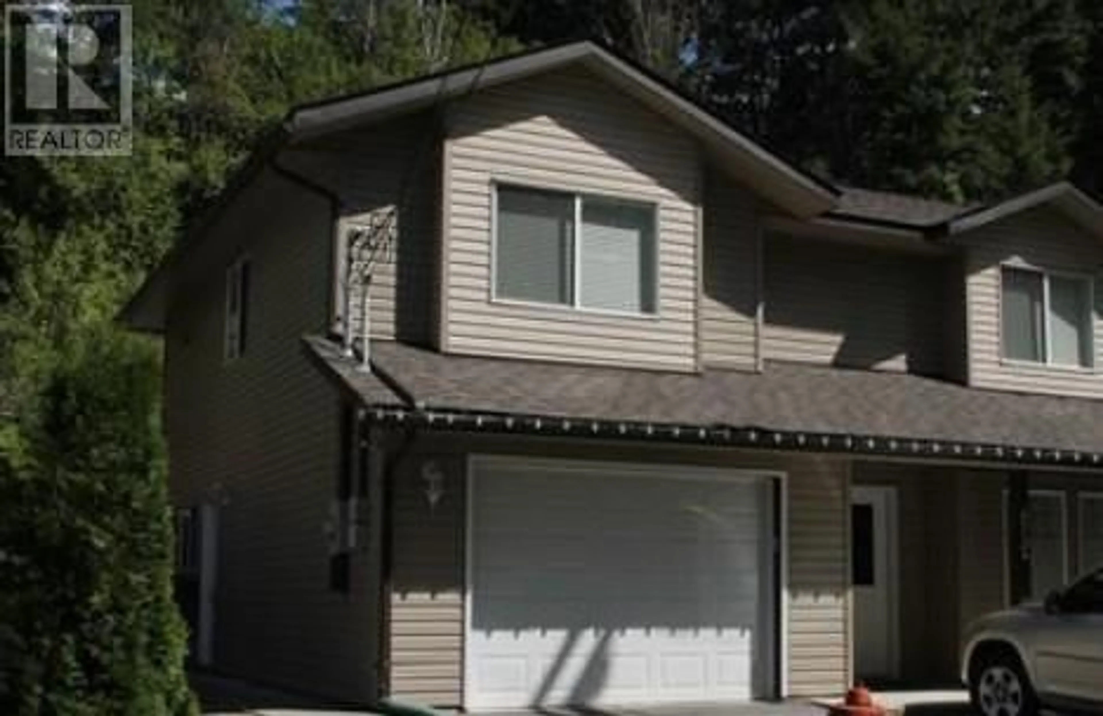 Home with vinyl exterior material, street for A-673 11TH AVE AVENUE, Castlegar British Columbia V1N1J7