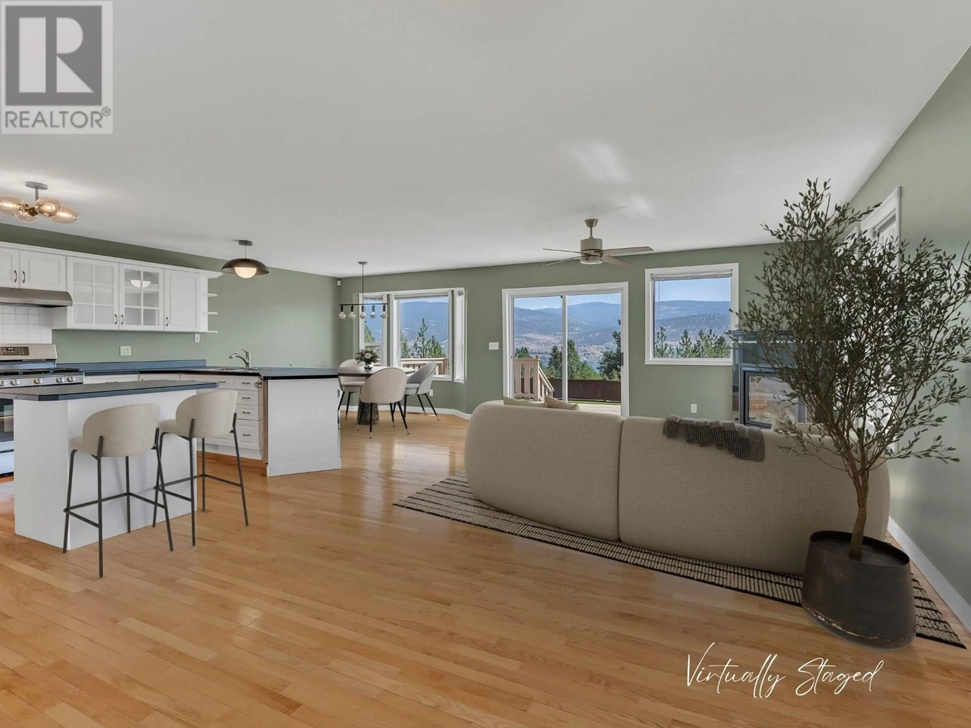 Open concept kitchen, wood/laminate floor for 1893 SANDSTONE DRIVE, Penticton British Columbia V2A8Y6