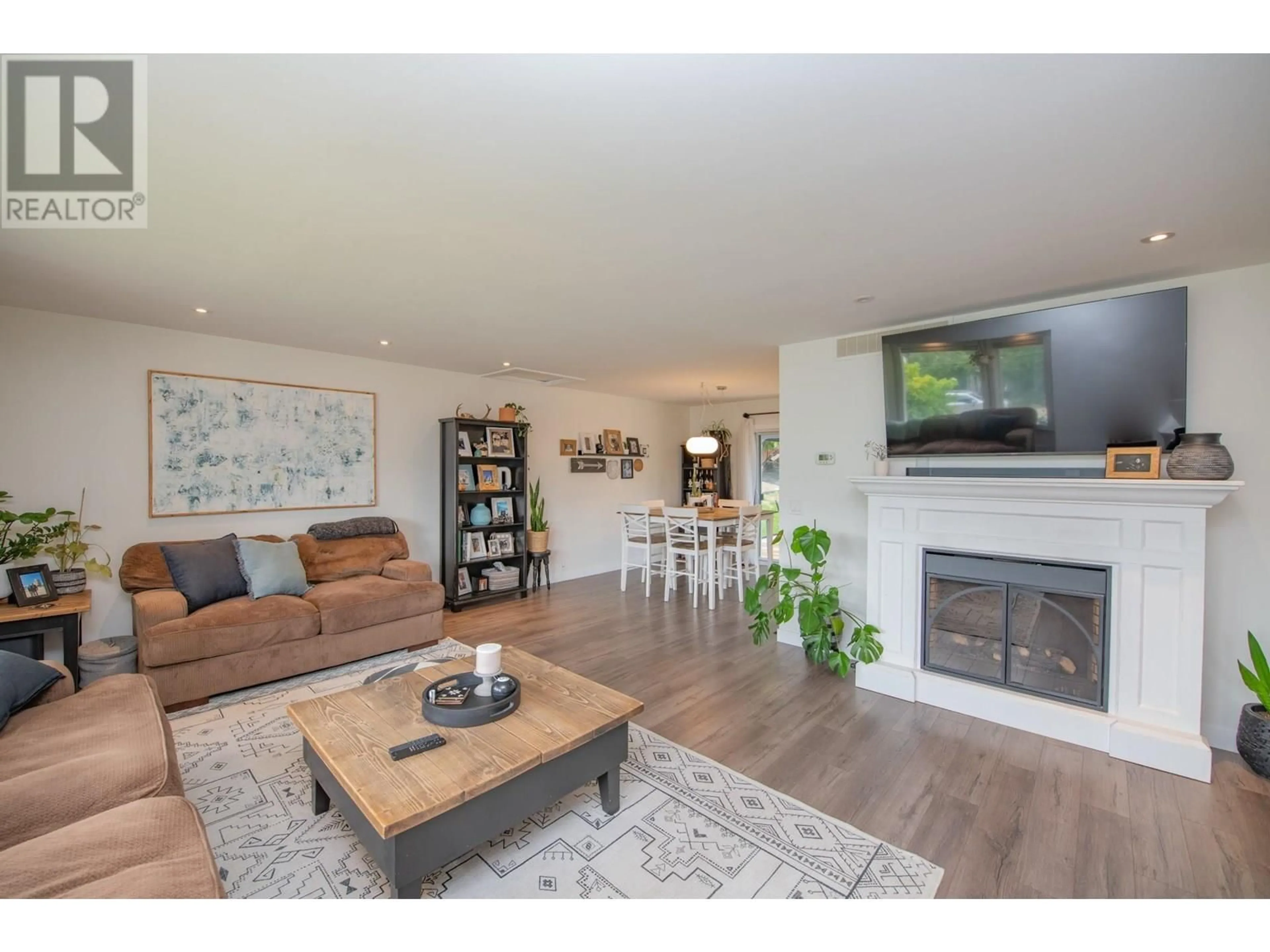 Living room with furniture, wood/laminate floor for 1890 GRANDVIEW AVENUE, Lumby British Columbia V0E2G0