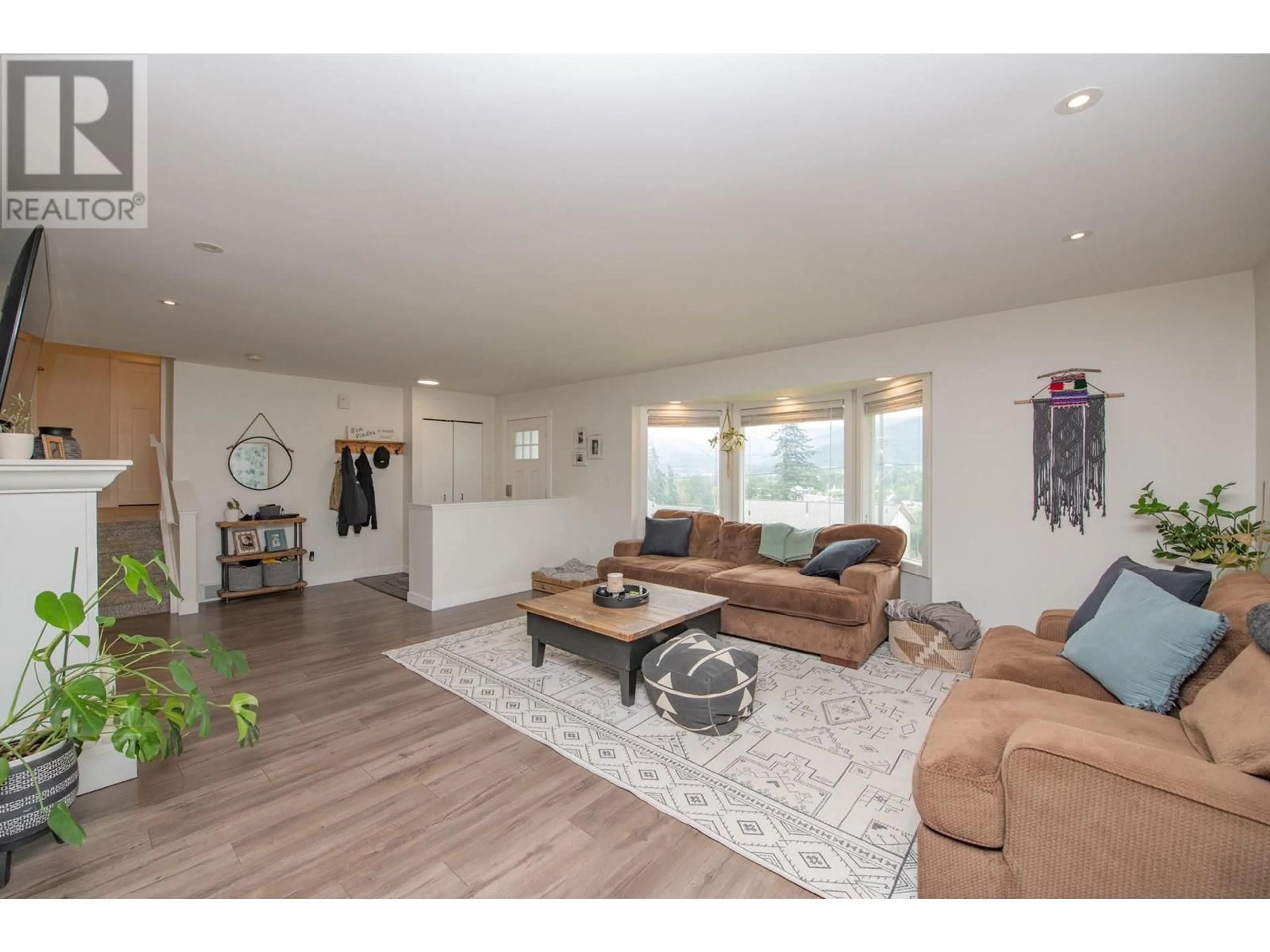 Living room with furniture, wood/laminate floor for 1890 GRANDVIEW AVENUE, Lumby British Columbia V0E2G0