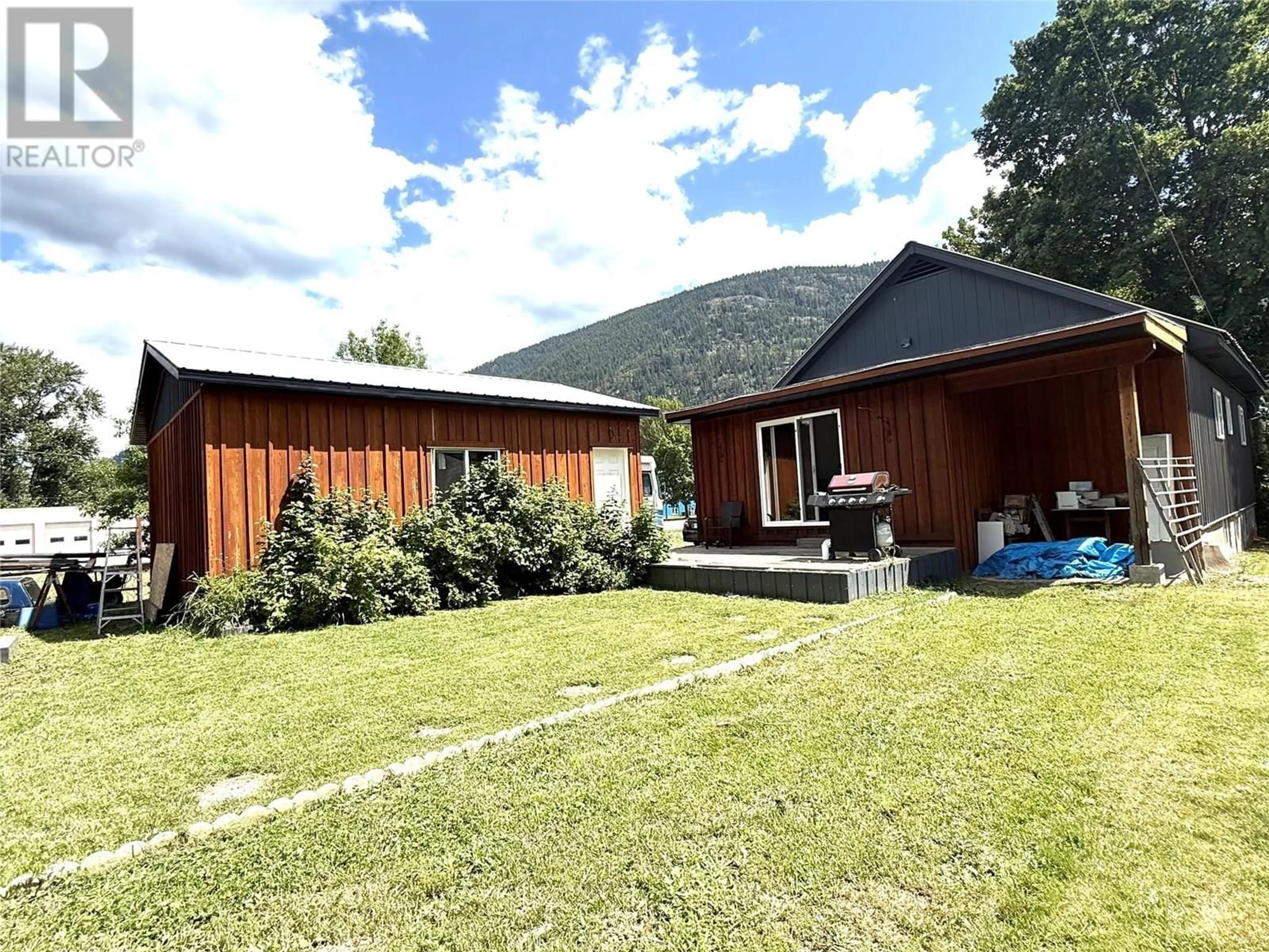 A pic from outside/outdoor area/front of a property/back of a property/a pic from drone, mountain view for 408 SAYWARD AVENUE, Salmo British Columbia V0G1Z0