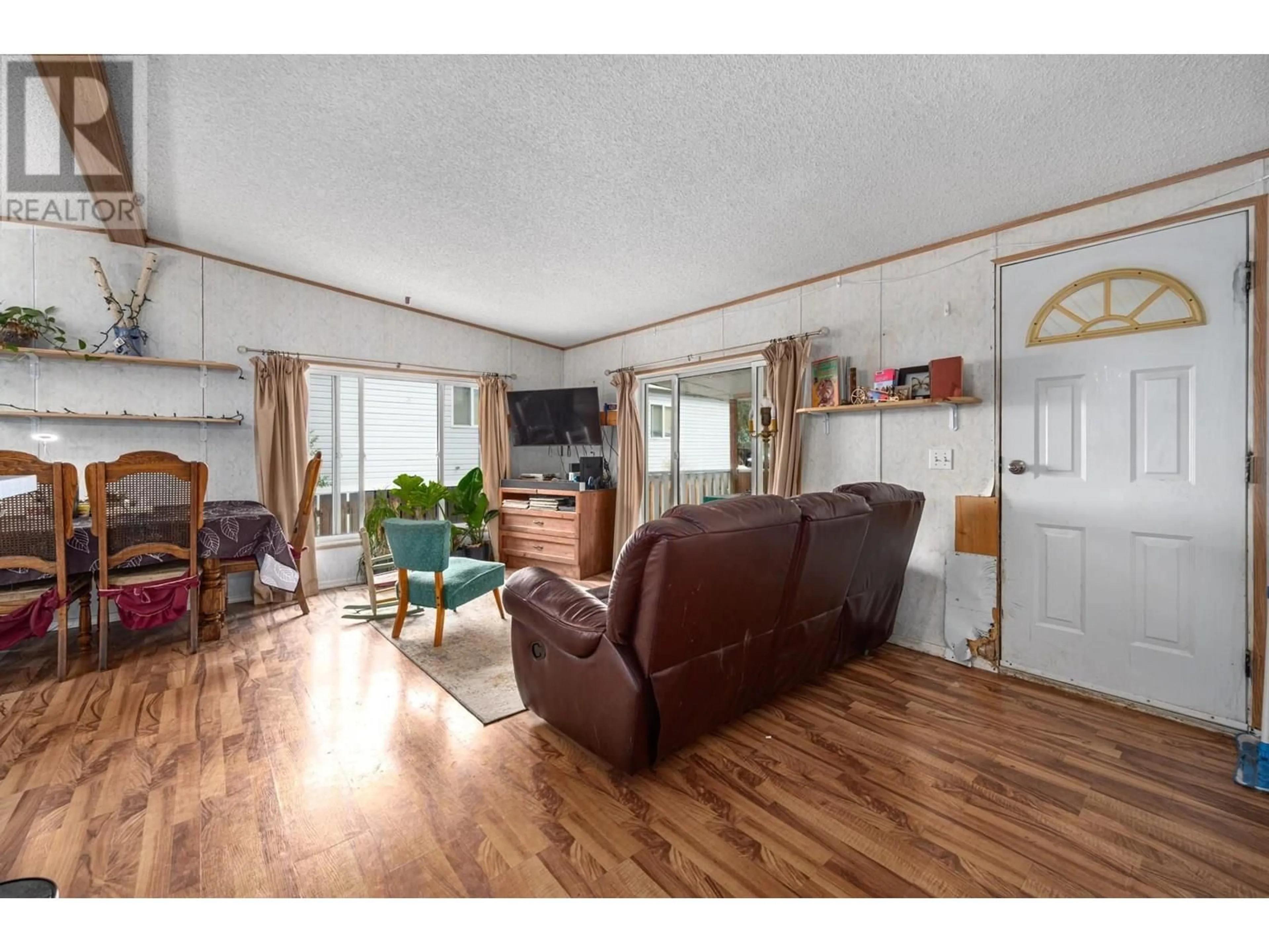 Living room with furniture, wood/laminate floor for 3677 STATION STREET, Ashcroft British Columbia V0K1A0