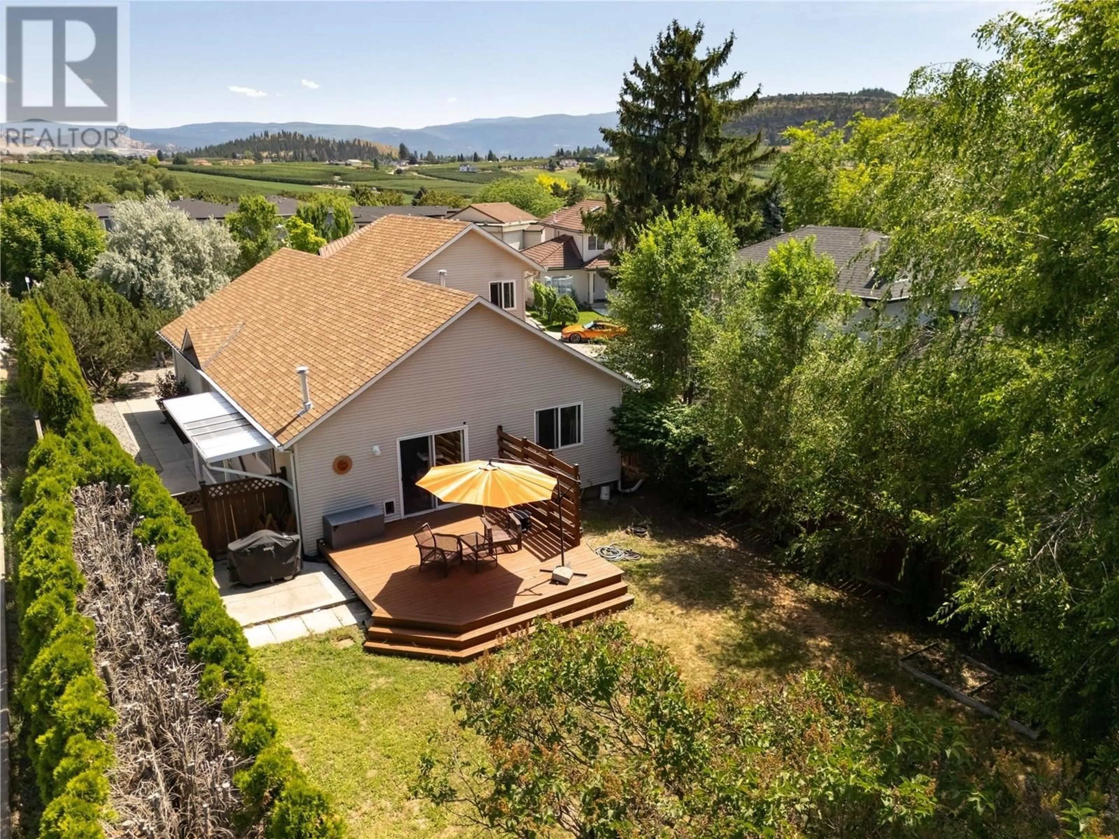 A pic from outside/outdoor area/front of a property/back of a property/a pic from drone, mountain view for 100 VERNA COURT, Kelowna British Columbia V1V1S9