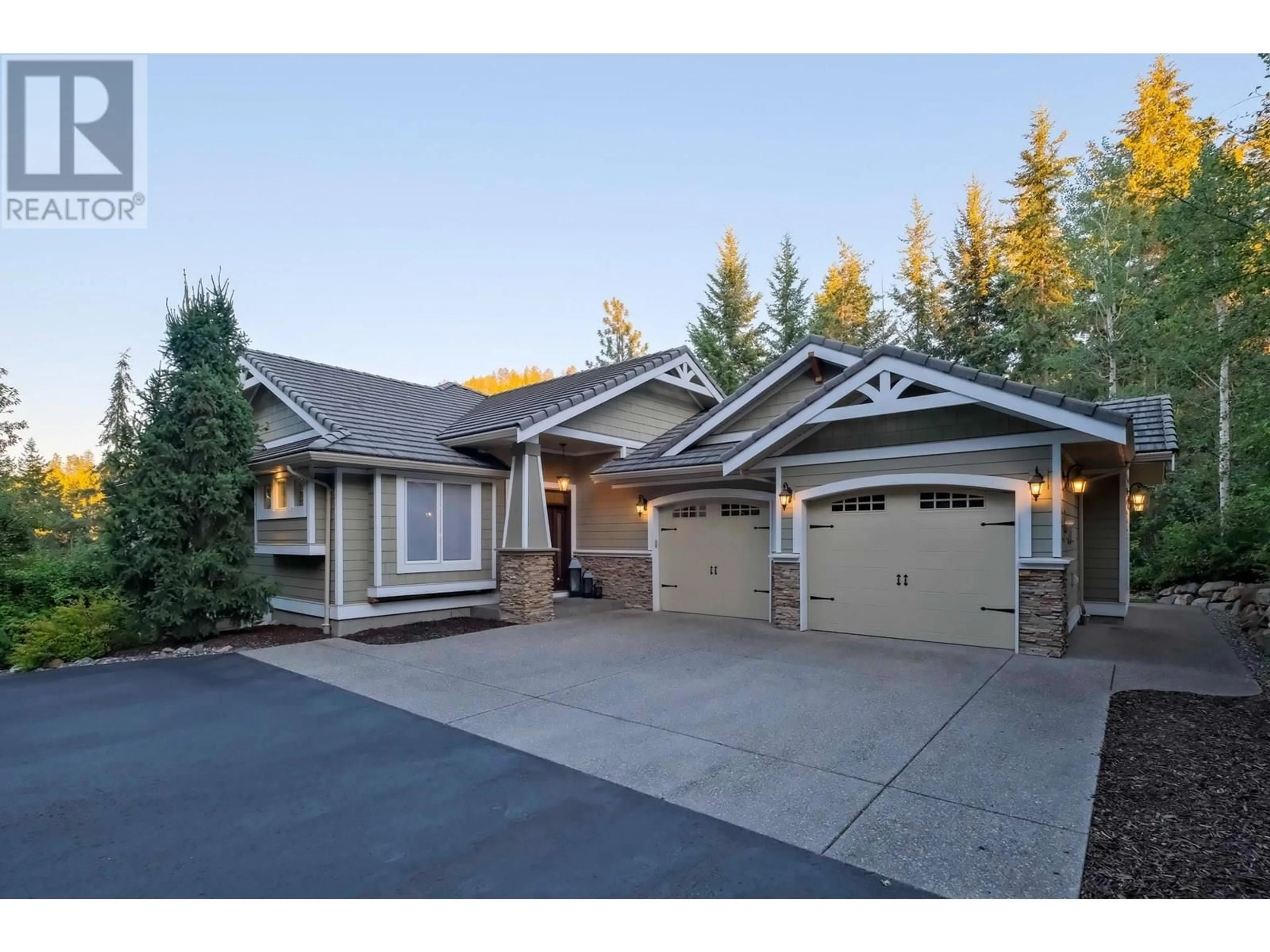 Home with vinyl exterior material, street for 2011 PARKWOOD DRIVE, Coldstream British Columbia V1B3Y4