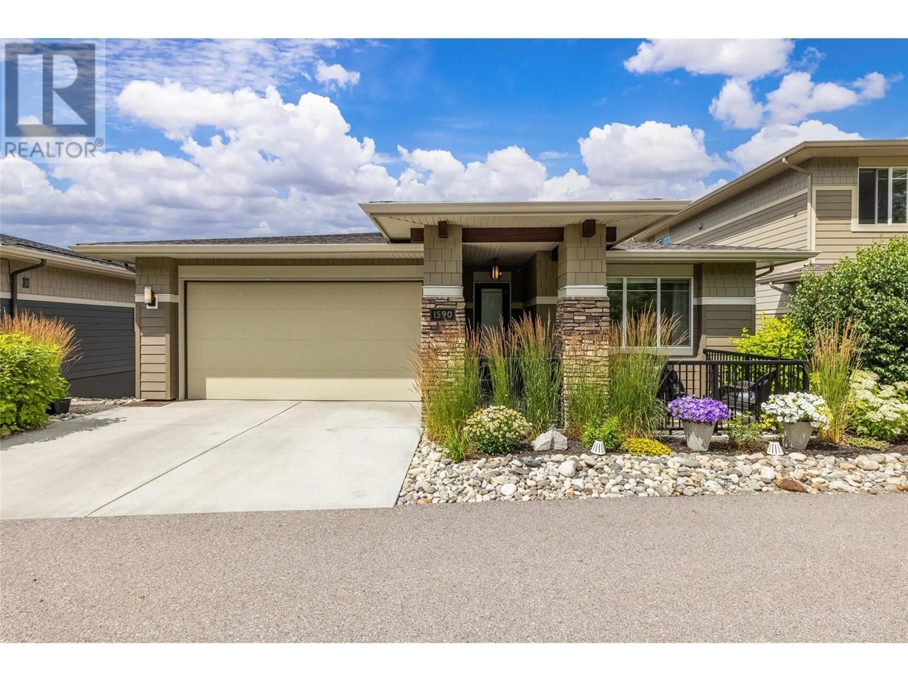 Home with brick exterior material, street for 1590 WINTER LANE, Kelowna British Columbia V1P1T2
