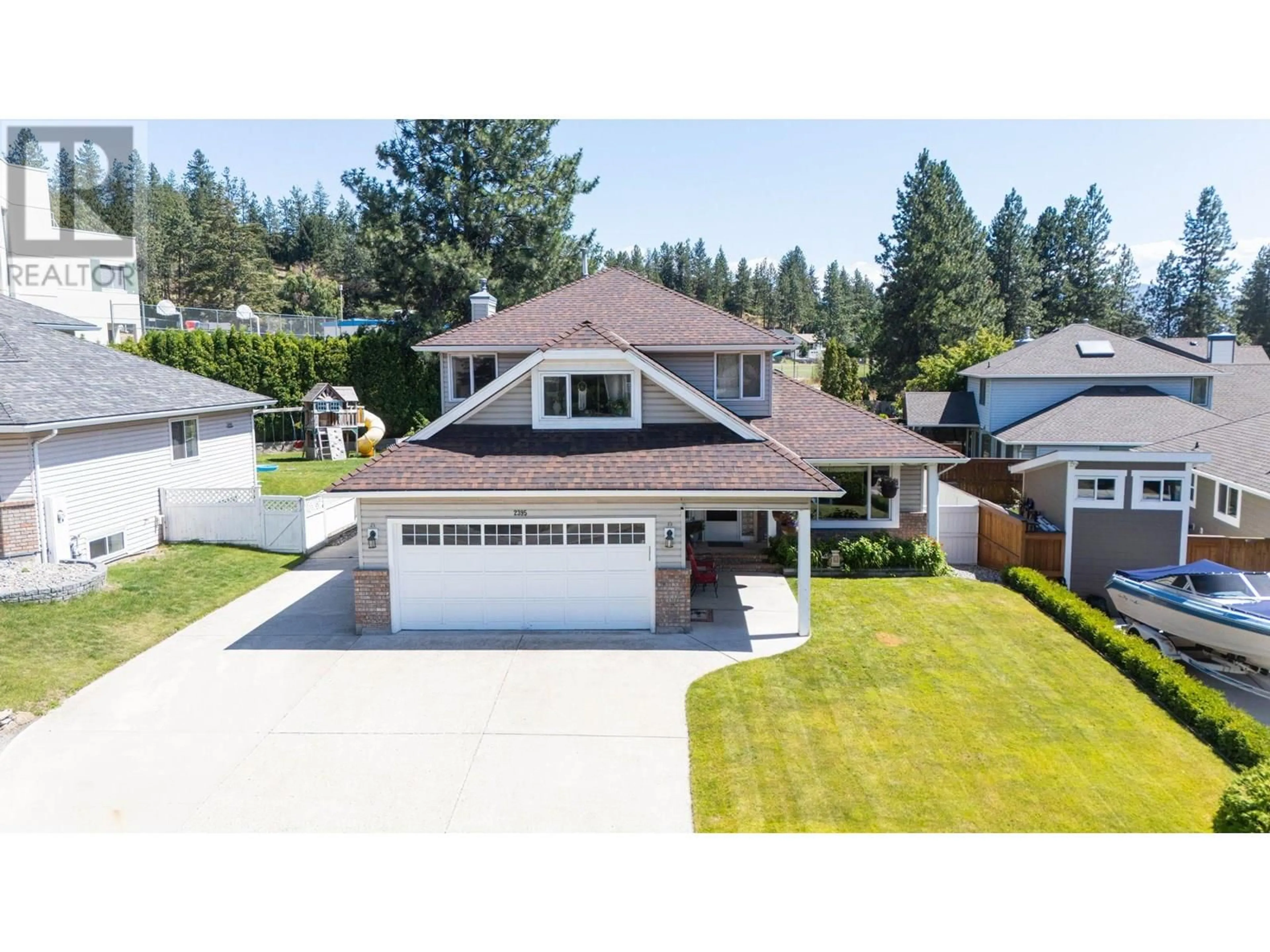 A pic from outside/outdoor area/front of a property/back of a property/a pic from drone, street for 2395 SHANNON RIDGE DRIVE, West Kelowna British Columbia V4T1T1