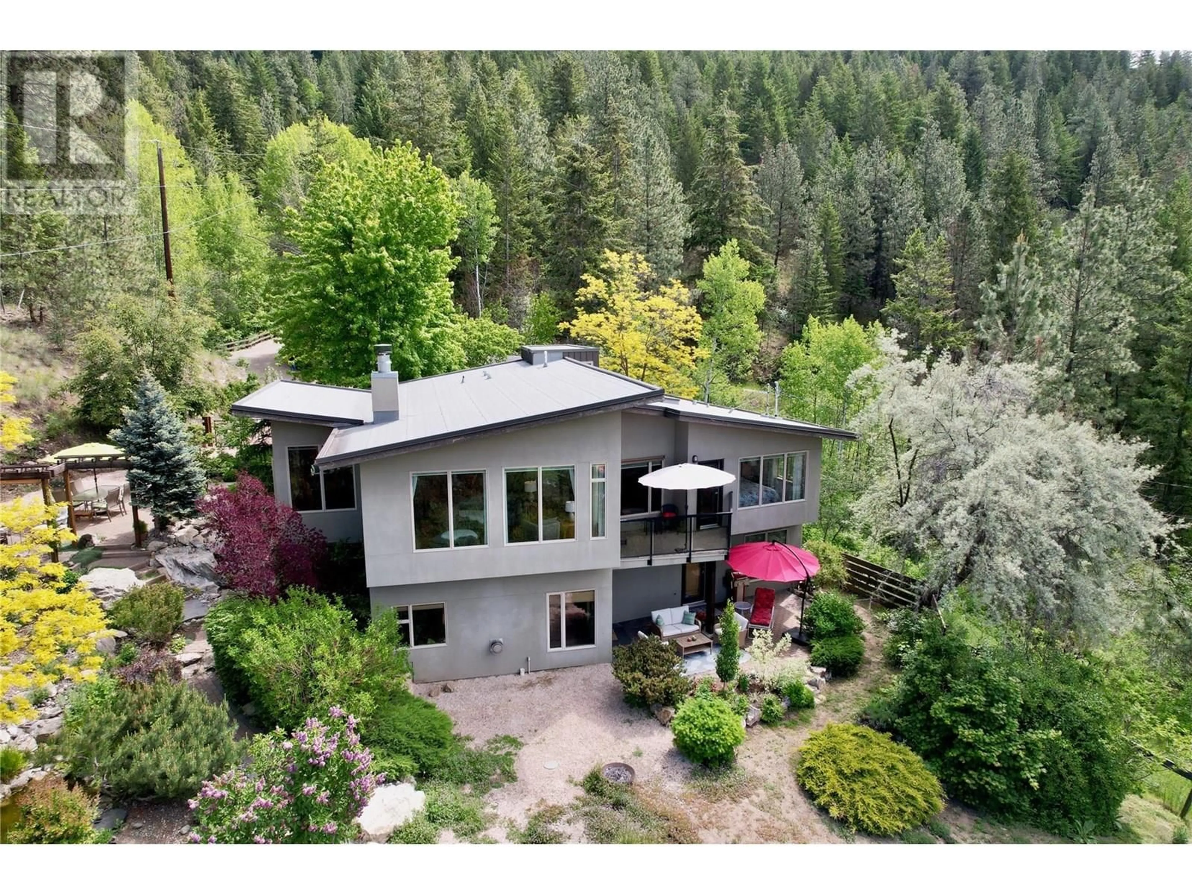 A pic from outside/outdoor area/front of a property/back of a property/a pic from drone, forest/trees view for 1294 GALIANO ROAD, Vernon British Columbia V1B3B3