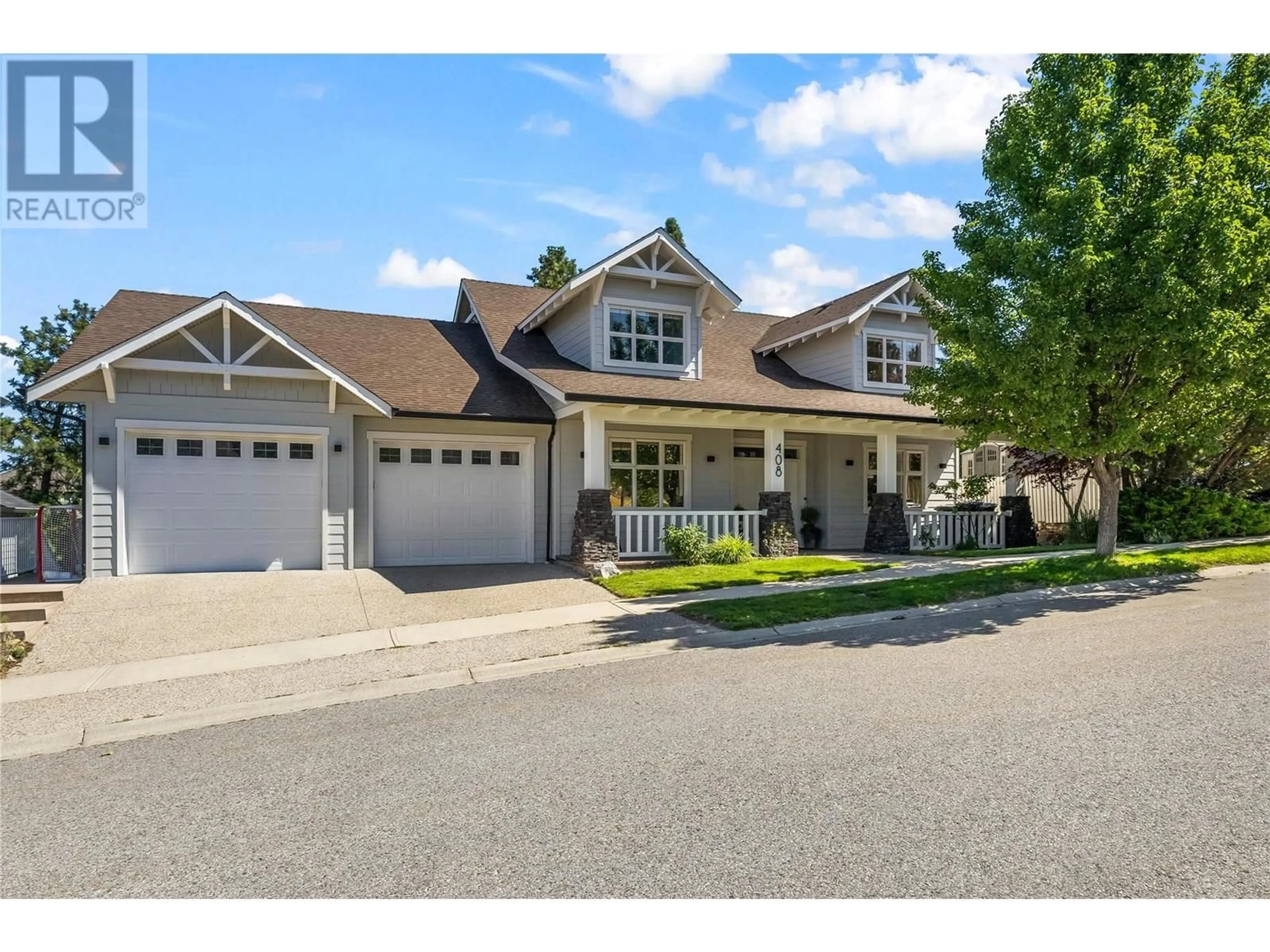 Home with vinyl exterior material, street for 408 QUILCHENA CRESCENT, Kelowna British Columbia V1W4W4