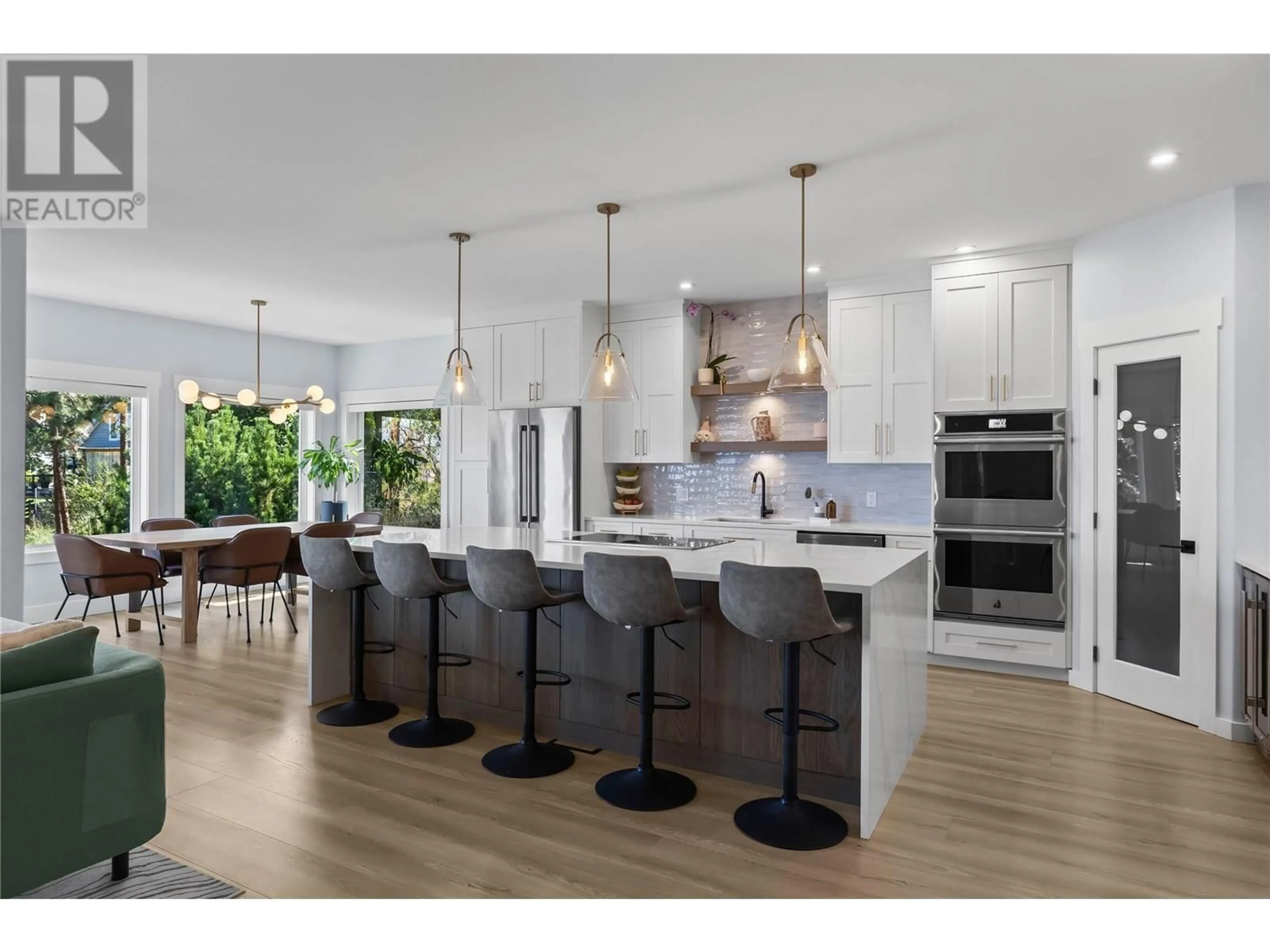 Open concept kitchen, wood/laminate floor for 408 QUILCHENA CRESCENT, Kelowna British Columbia V1W4W4