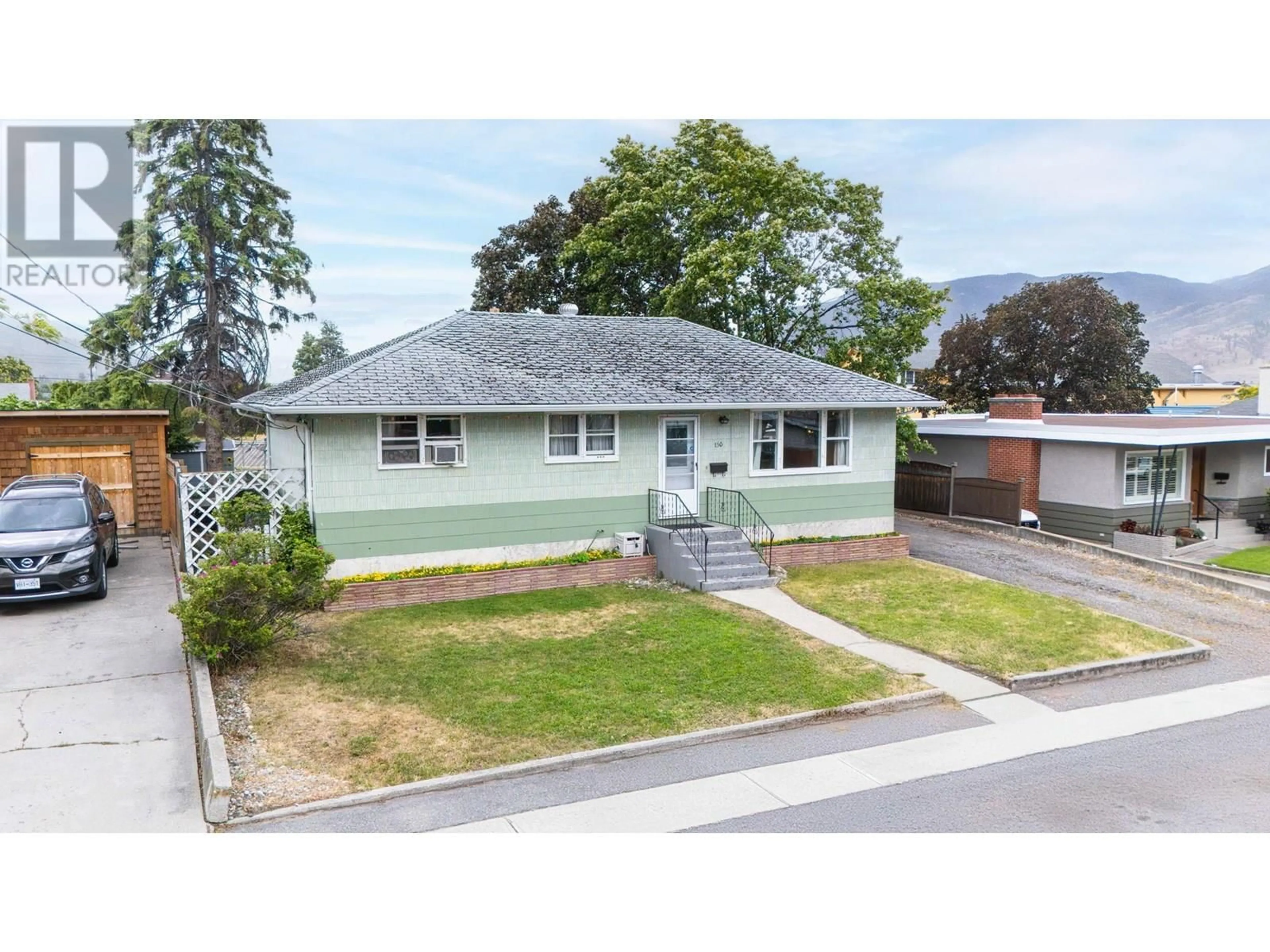 A pic from outside/outdoor area/front of a property/back of a property/a pic from drone, street for 150 BENNETT AVENUE, Penticton British Columbia V2A6G2