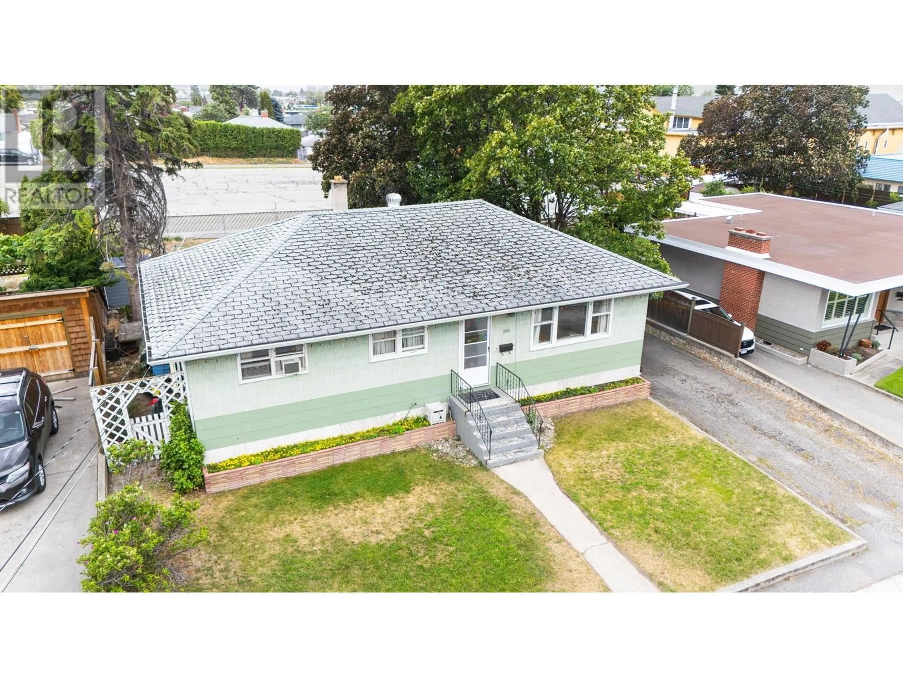 A pic from outside/outdoor area/front of a property/back of a property/a pic from drone, street for 150 BENNETT AVENUE, Penticton British Columbia V2A6G2
