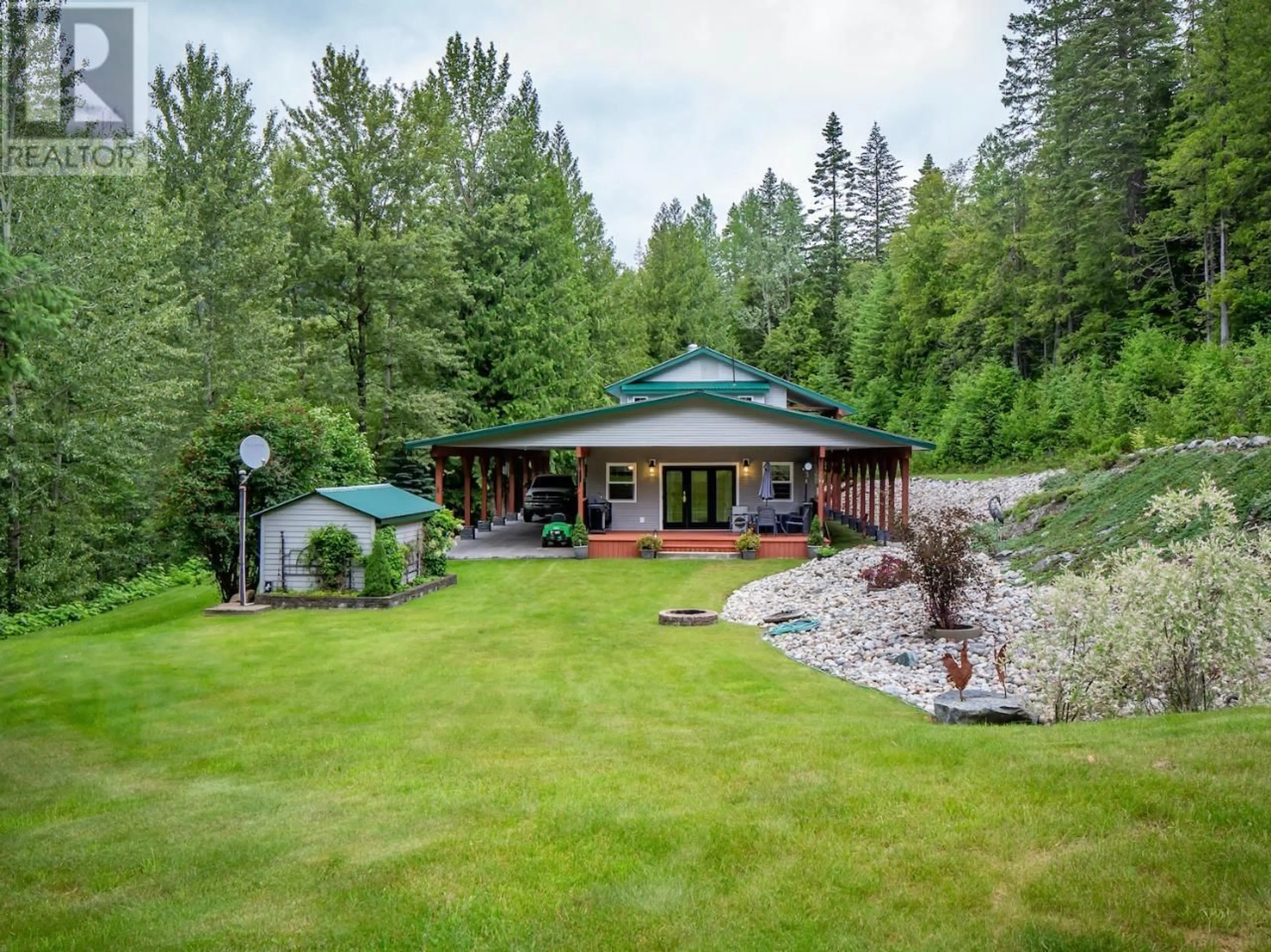 A pic from outside/outdoor area/front of a property/back of a property/a pic from drone, forest/trees view for 1160 22 HIGHWAY, Rossland British Columbia V0G1Y0