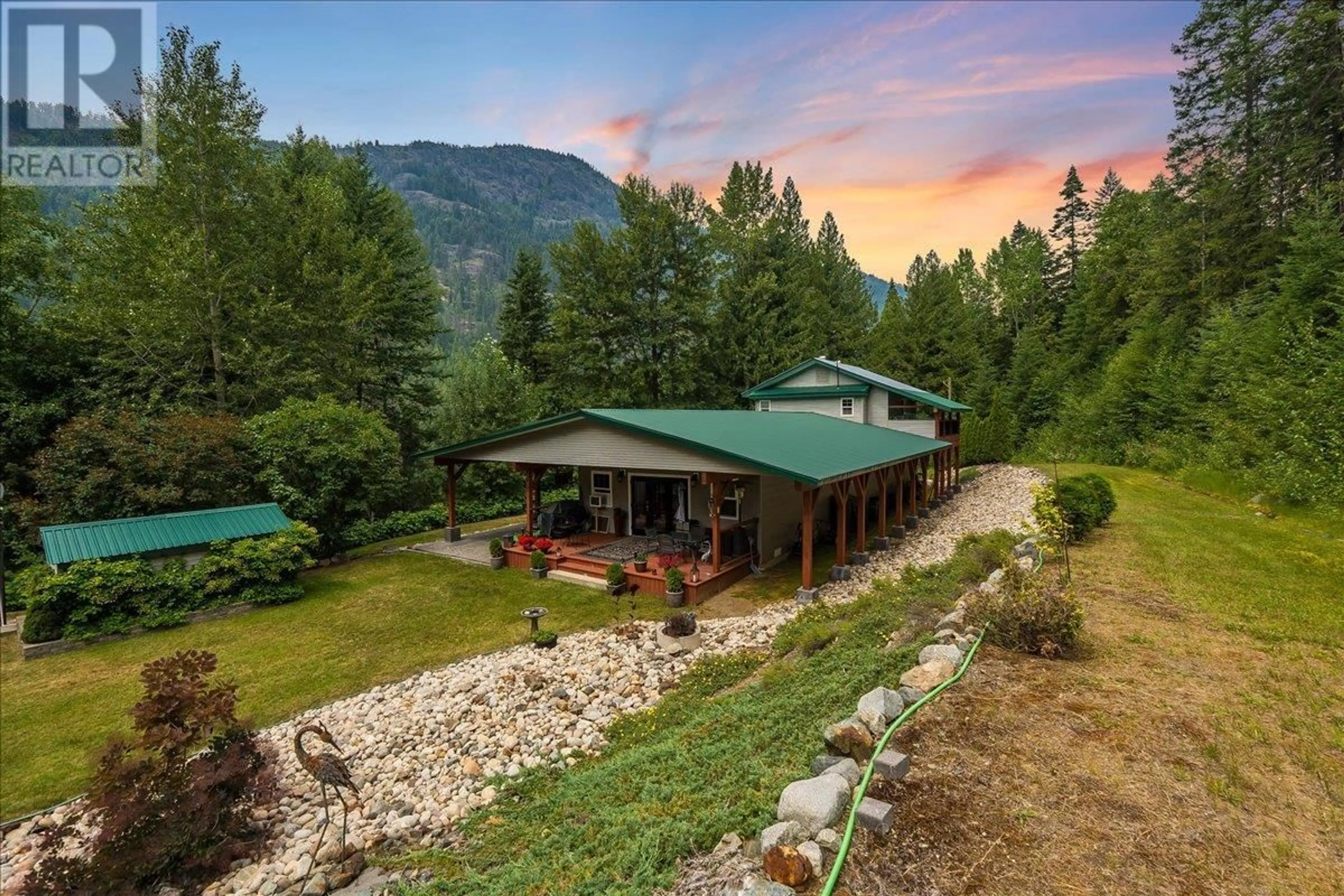 A pic from outside/outdoor area/front of a property/back of a property/a pic from drone, mountain view for 1160 22 HIGHWAY, Rossland British Columbia V0G1Y0