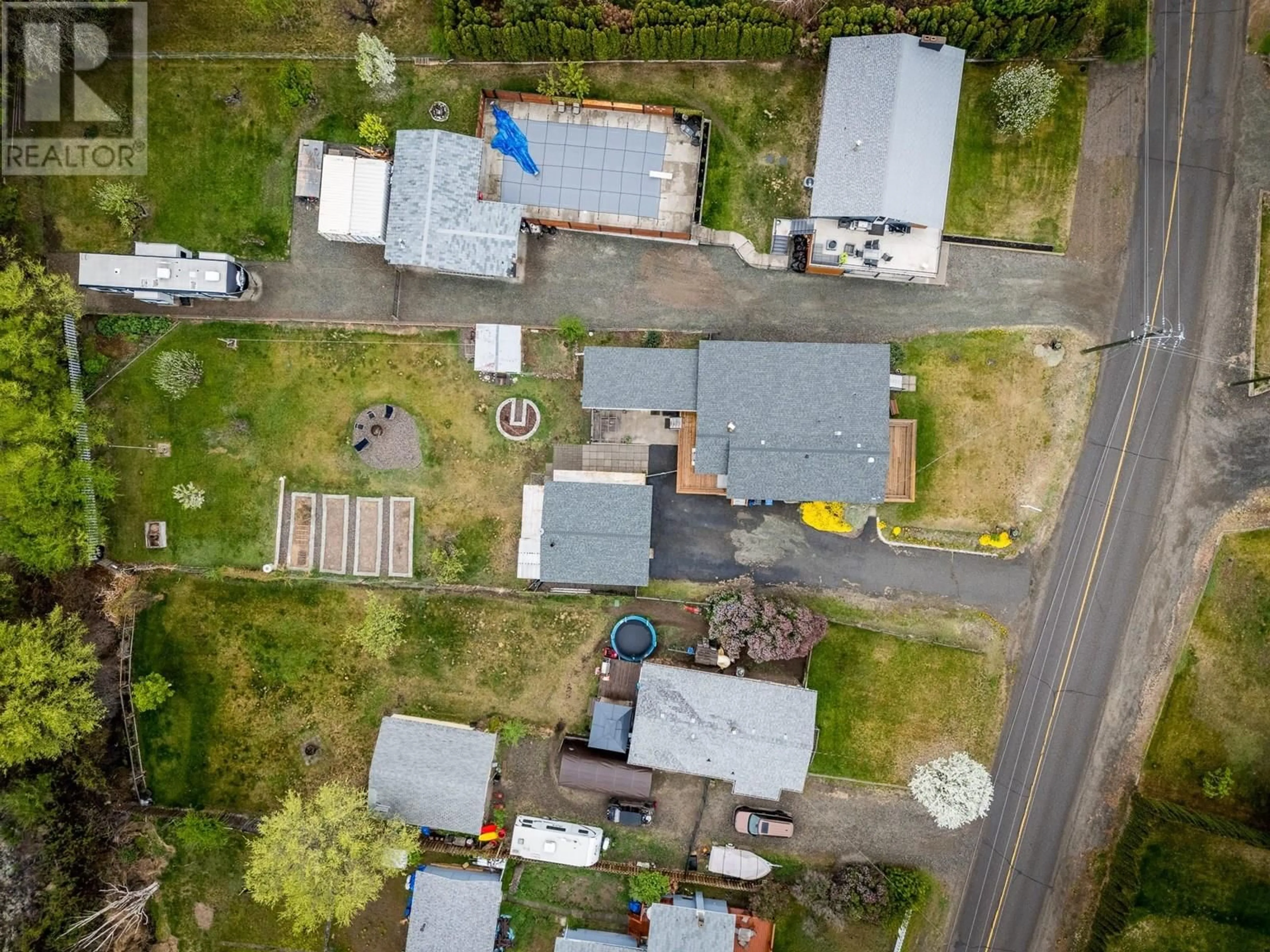 A pic from outside/outdoor area/front of a property/back of a property/a pic from drone, street for 7040 SAVONA ACCESS ROAD, Kamloops British Columbia V0K2J0