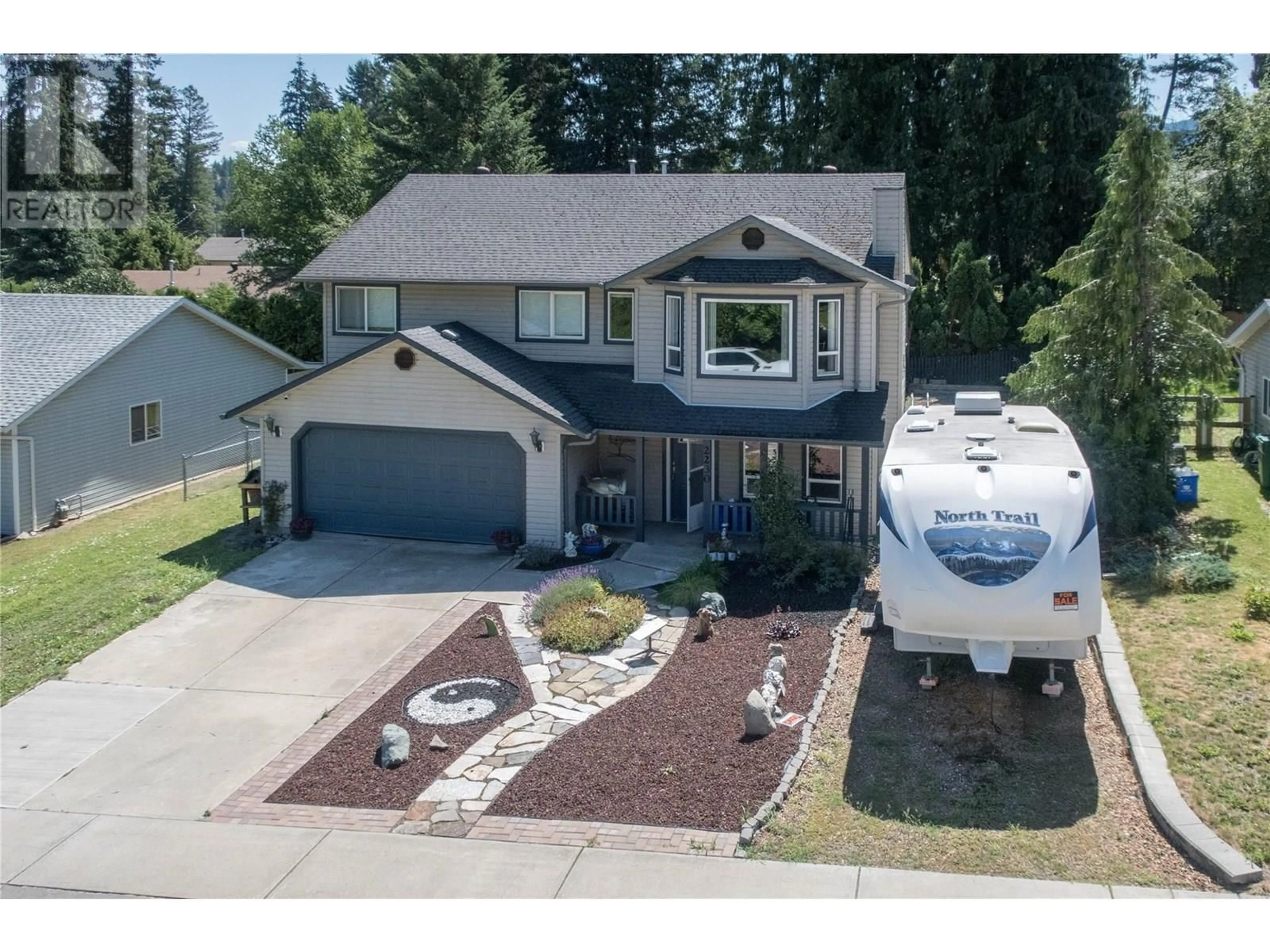 A pic from outside/outdoor area/front of a property/back of a property/a pic from drone, street for 2230 LINEA CRESCENT, Lumby British Columbia V0E2G0