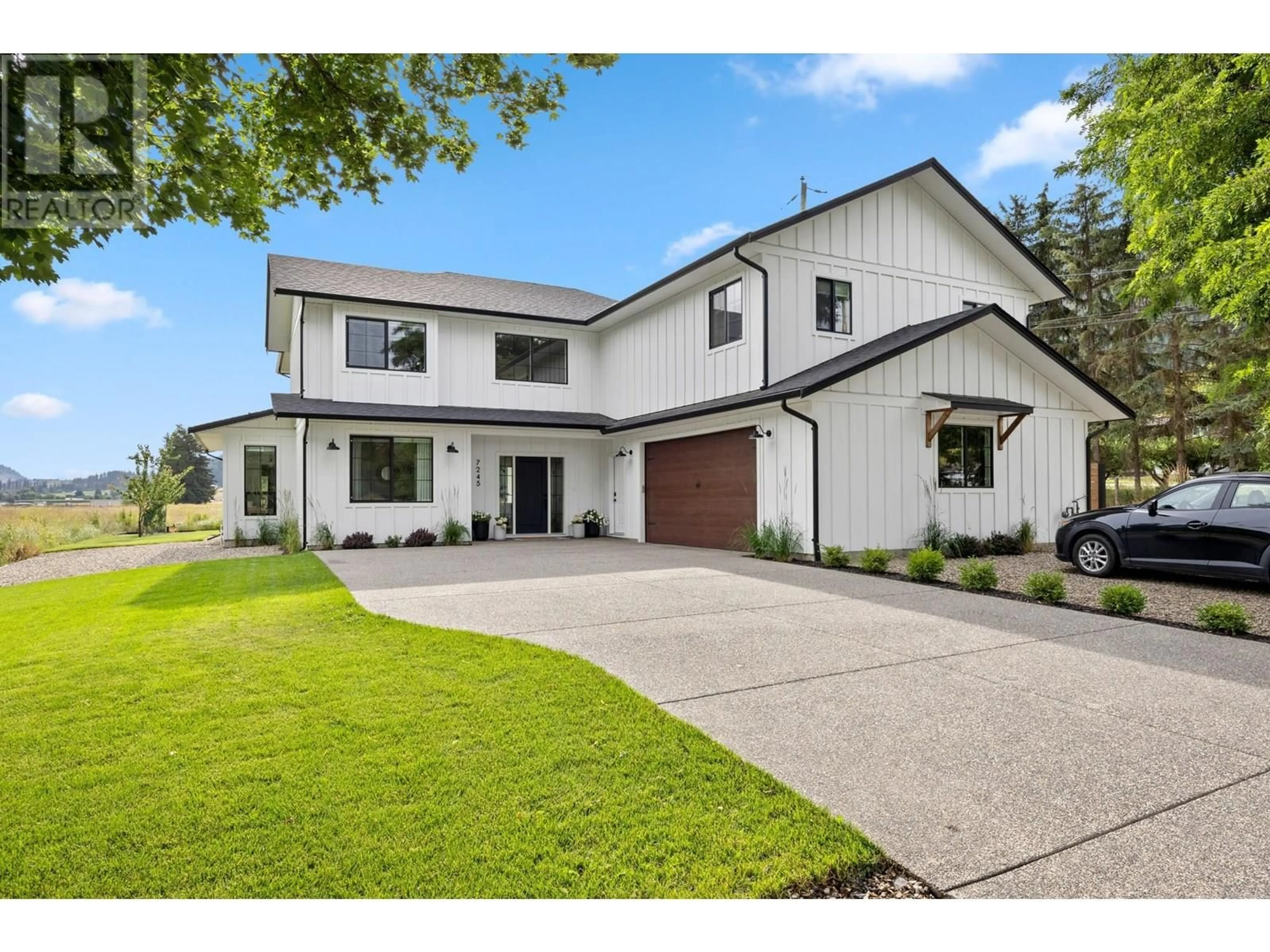 Home with vinyl exterior material, street for 7245 BREWER ROAD, Coldstream British Columbia V1B3H3