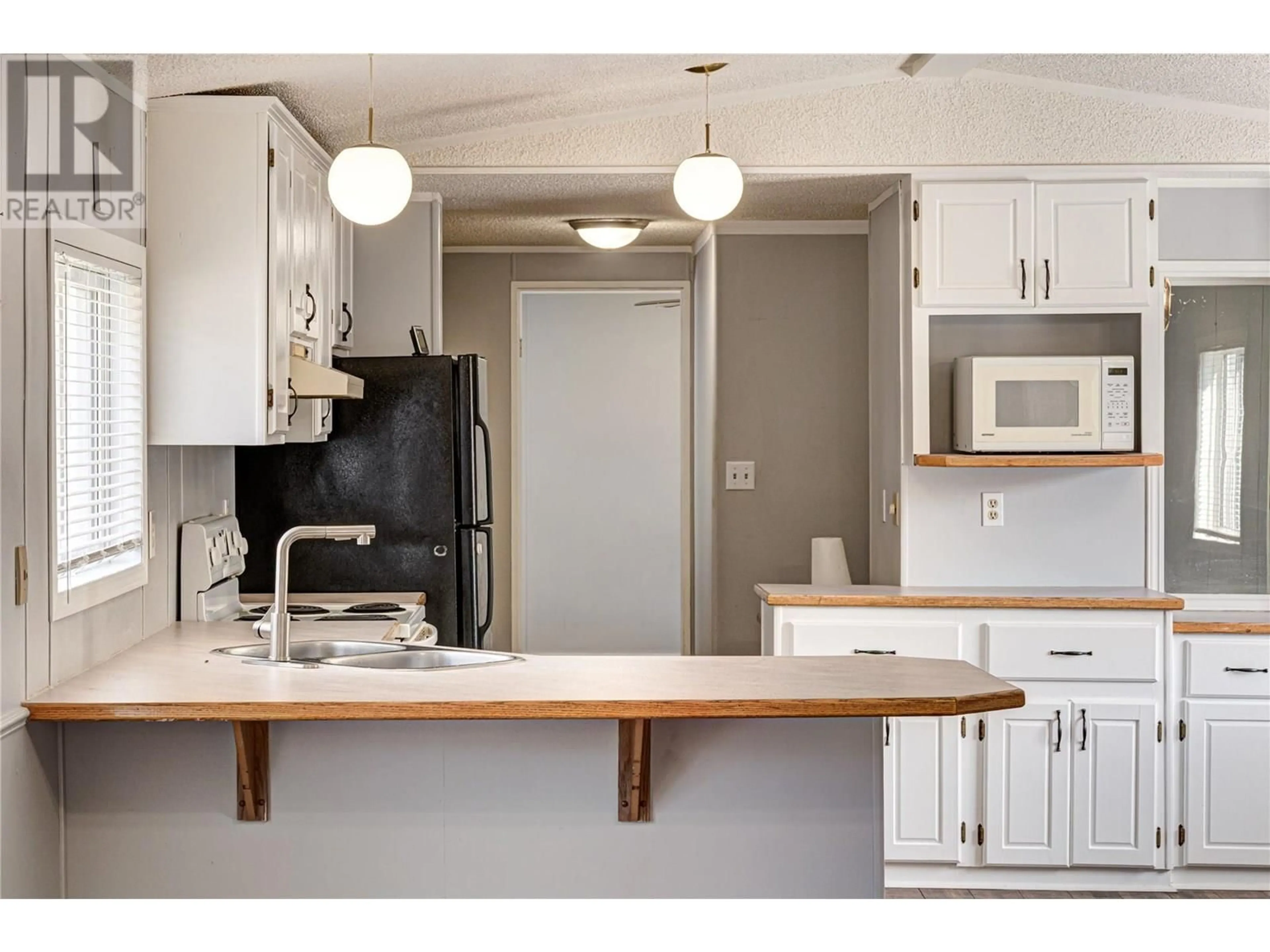 Standard kitchen, wood/laminate floor for 79 - 100 ASPEN DRIVE, Sparwood British Columbia V0B2G0