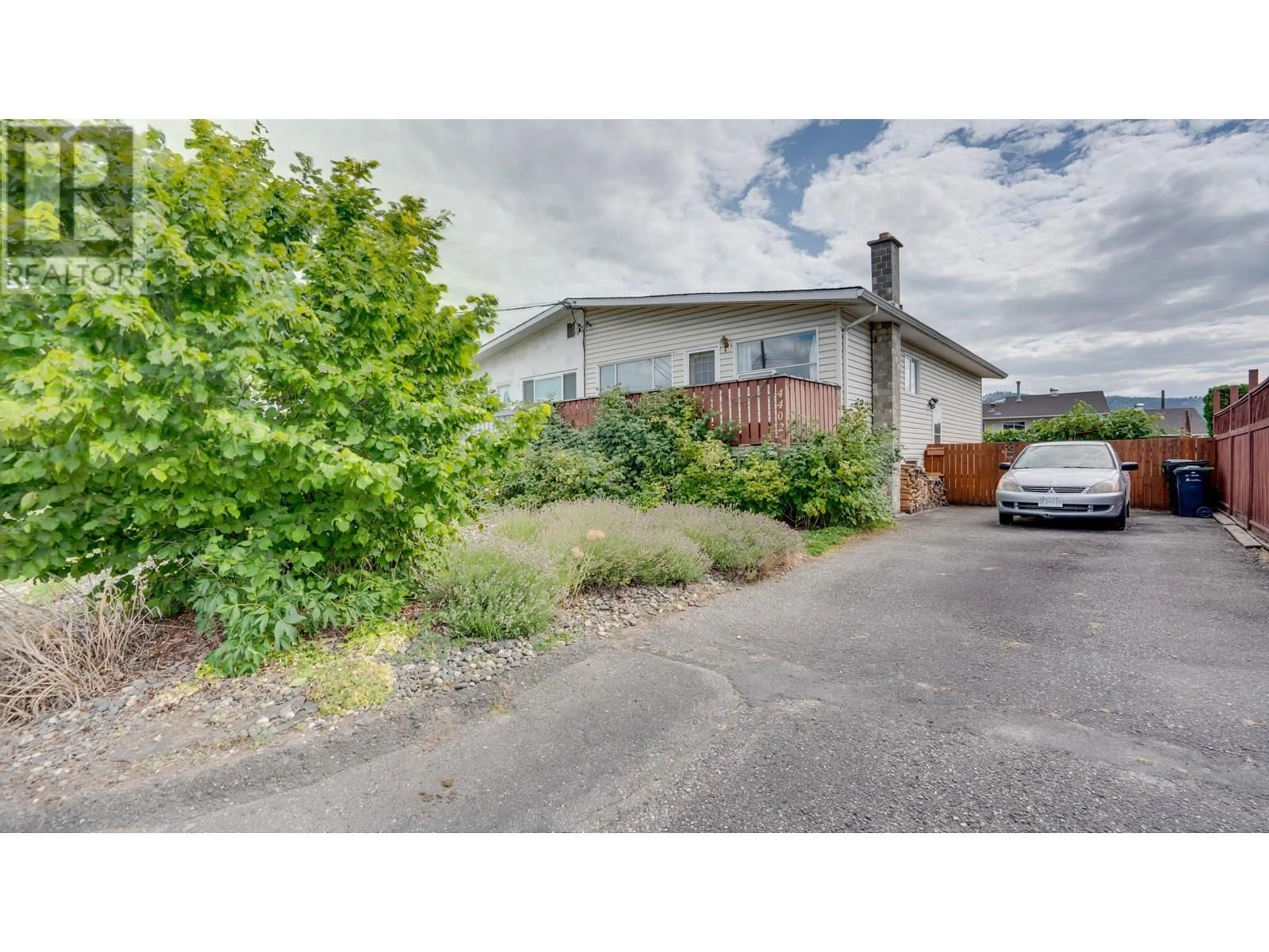 A pic from outside/outdoor area/front of a property/back of a property/a pic from drone, street for 4402 15 AVENUE, Vernon British Columbia V1T6X9
