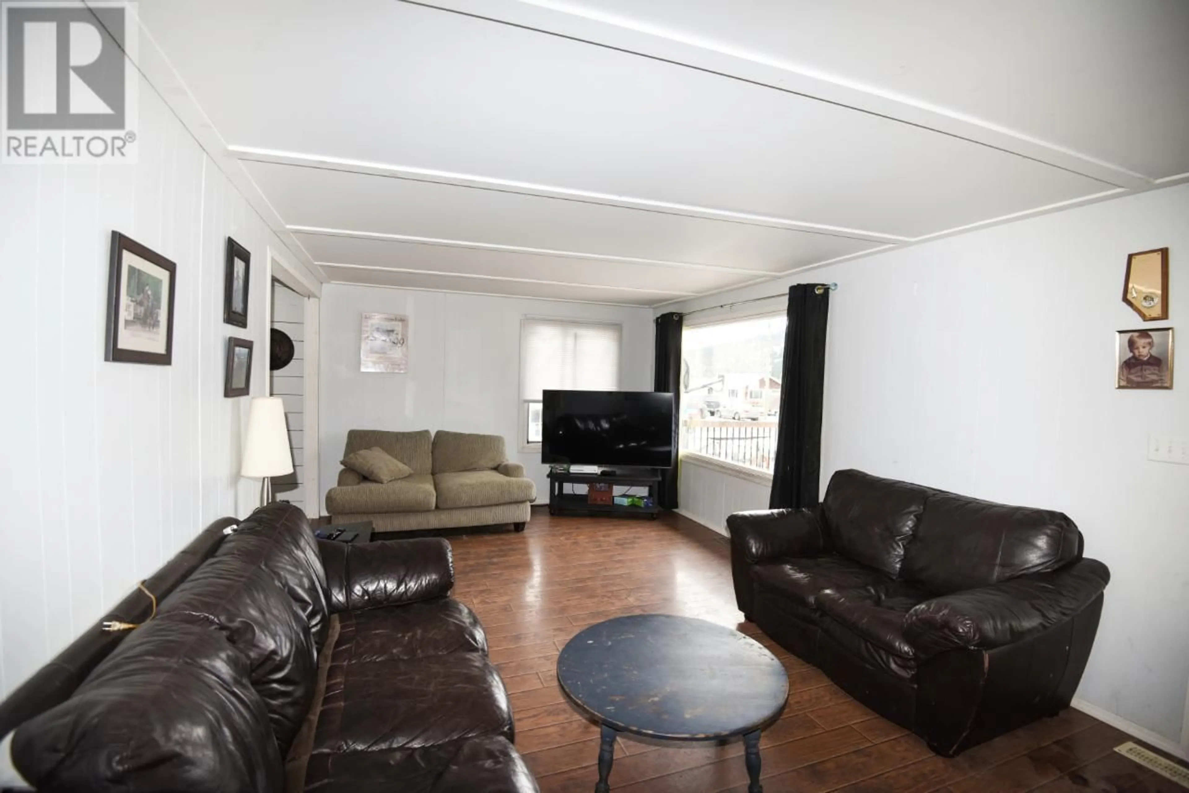 Living room with furniture, wood/laminate floor for 1404 SOUES STREET, Clinton British Columbia V0K1K0