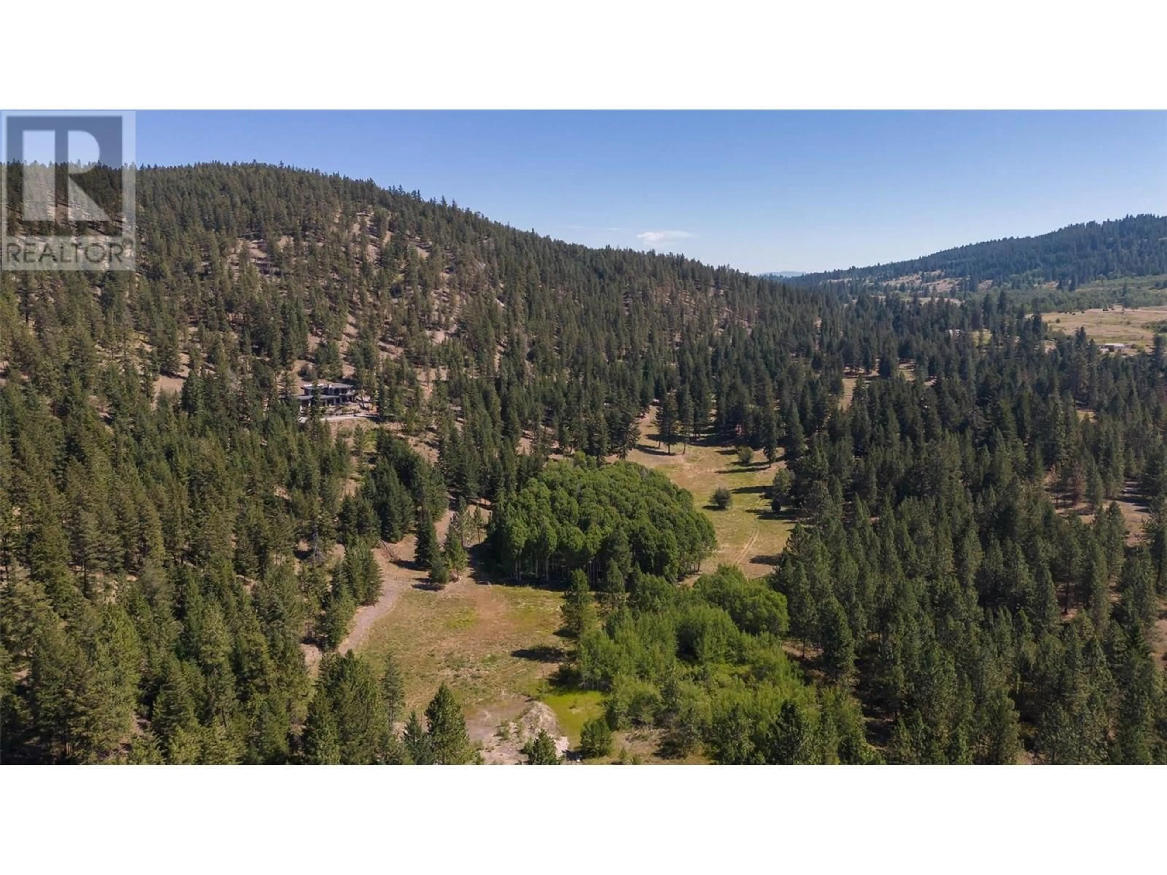A pic from outside/outdoor area/front of a property/back of a property/a pic from drone, forest/trees view for 26 COMMONAGE ROAD, Vernon British Columbia V1H1G4