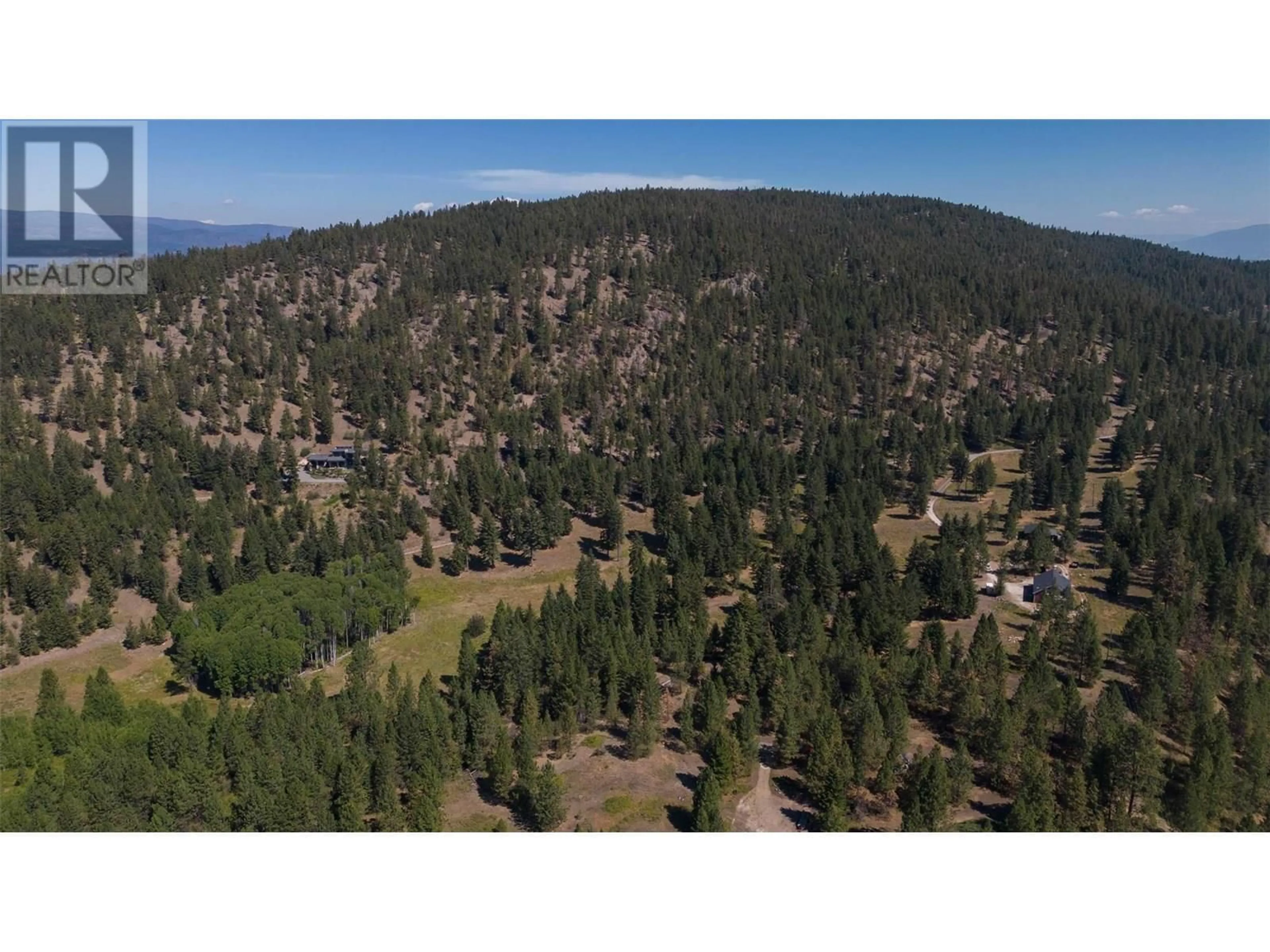 A pic from outside/outdoor area/front of a property/back of a property/a pic from drone, forest/trees view for 26 COMMONAGE ROAD, Vernon British Columbia V1H1G4