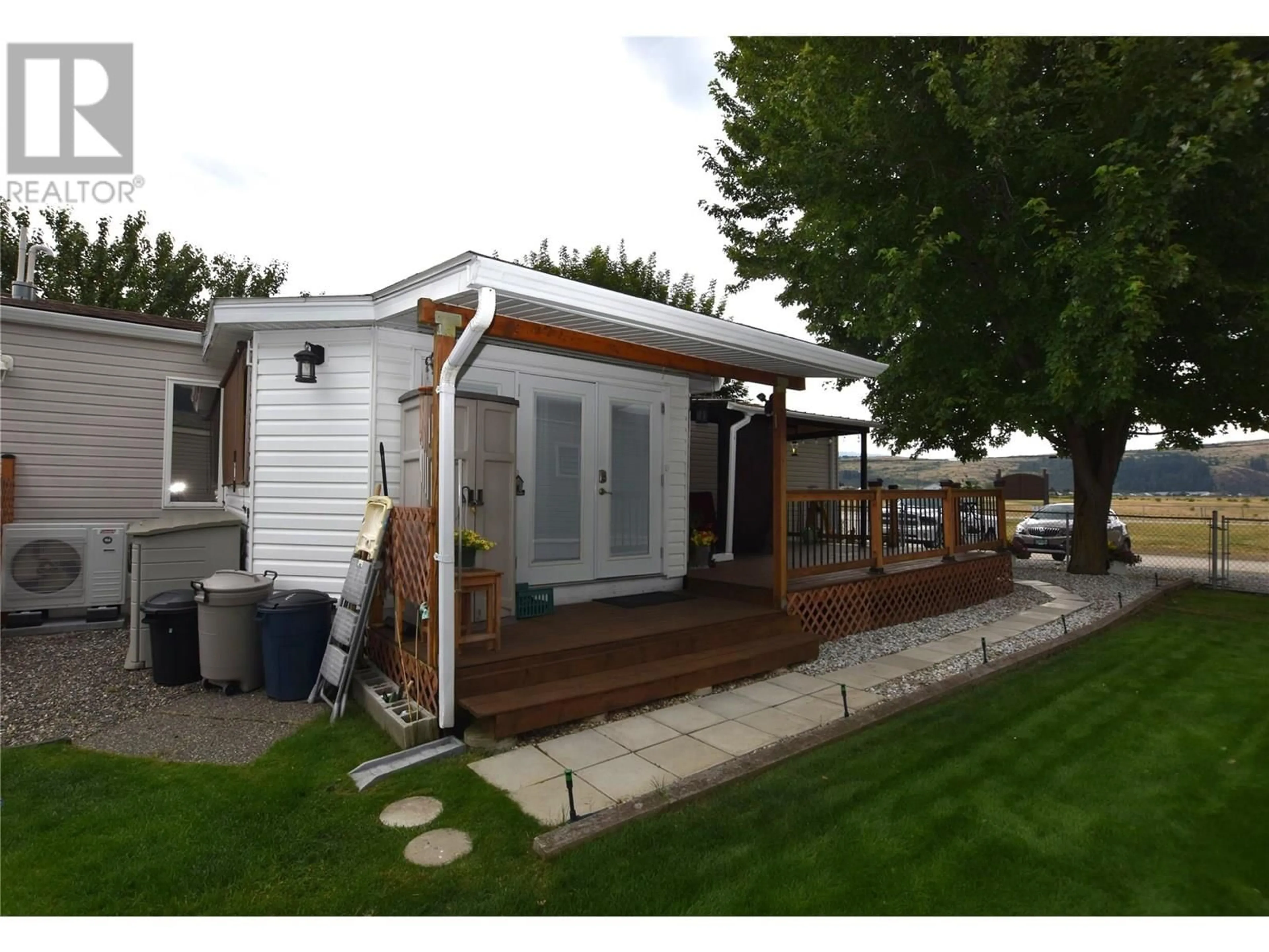 Home with vinyl exterior material, street for 3 - 12560 WESTSIDE ROAD, Vernon British Columbia V1H1S9