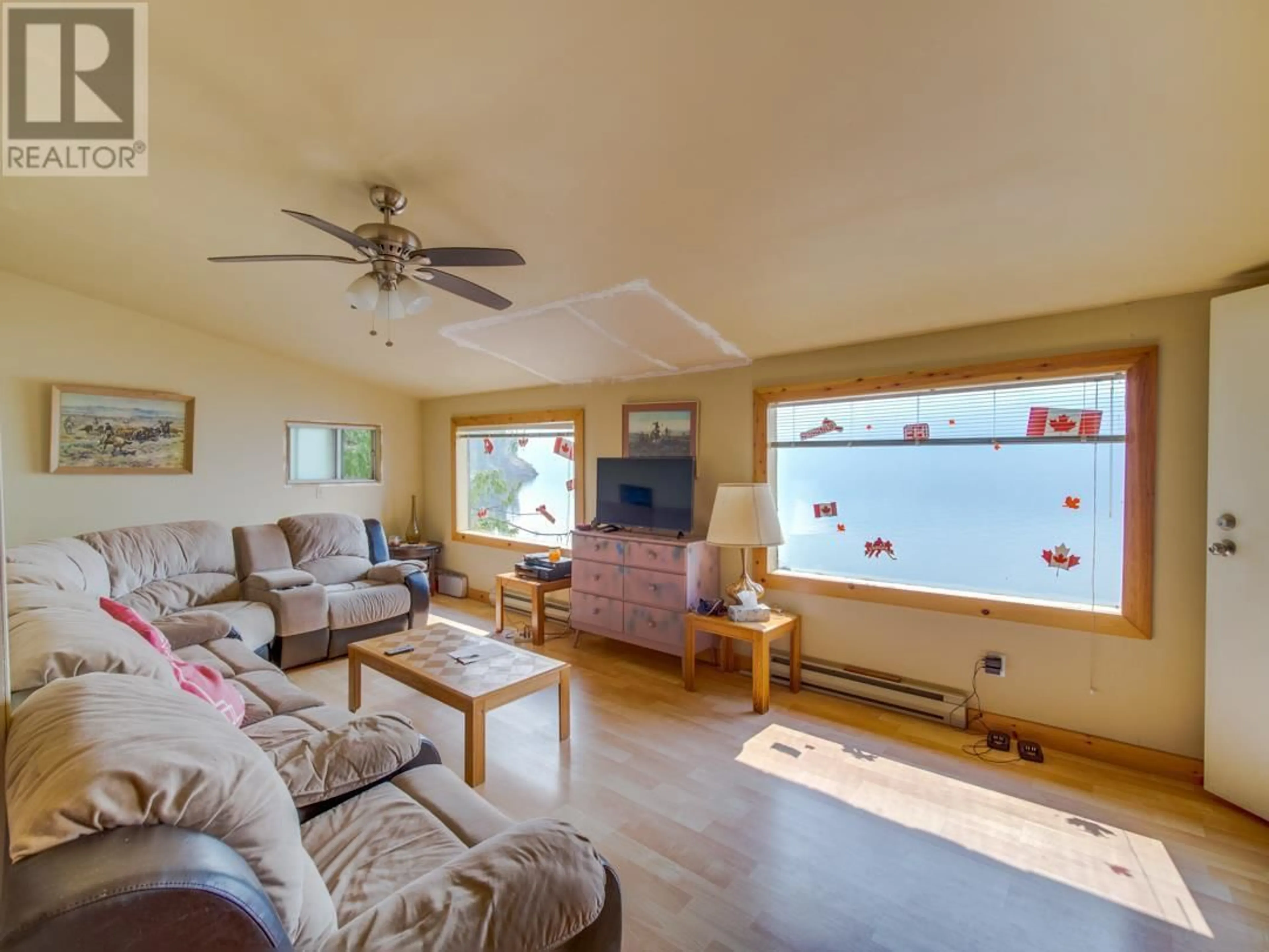 Living room with furniture, wood/laminate floor for 26 SIMARD ROAD, Enderby British Columbia V0E1V5