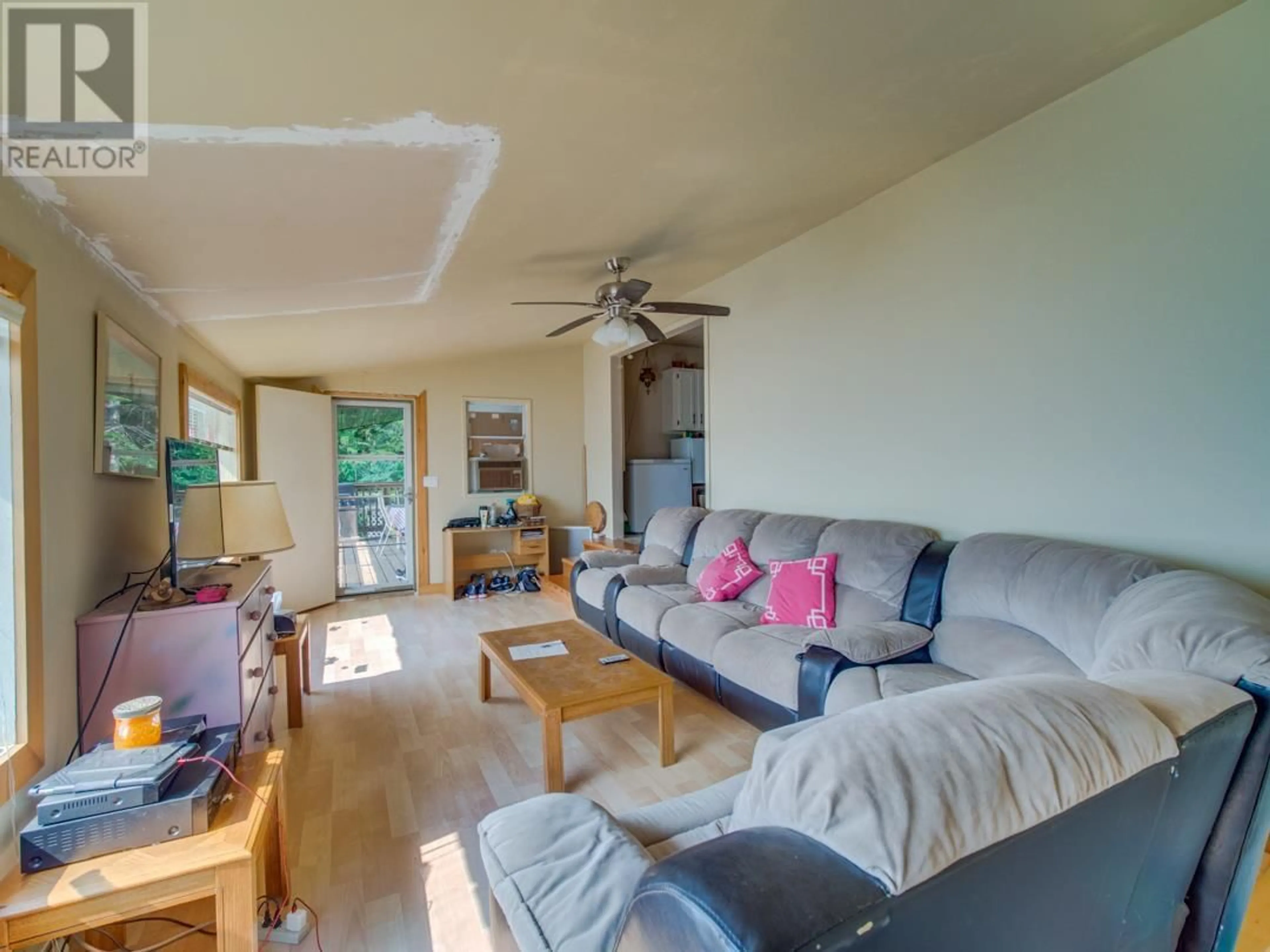 Living room with furniture, wood/laminate floor for 26 SIMARD ROAD, Enderby British Columbia V0E1V5