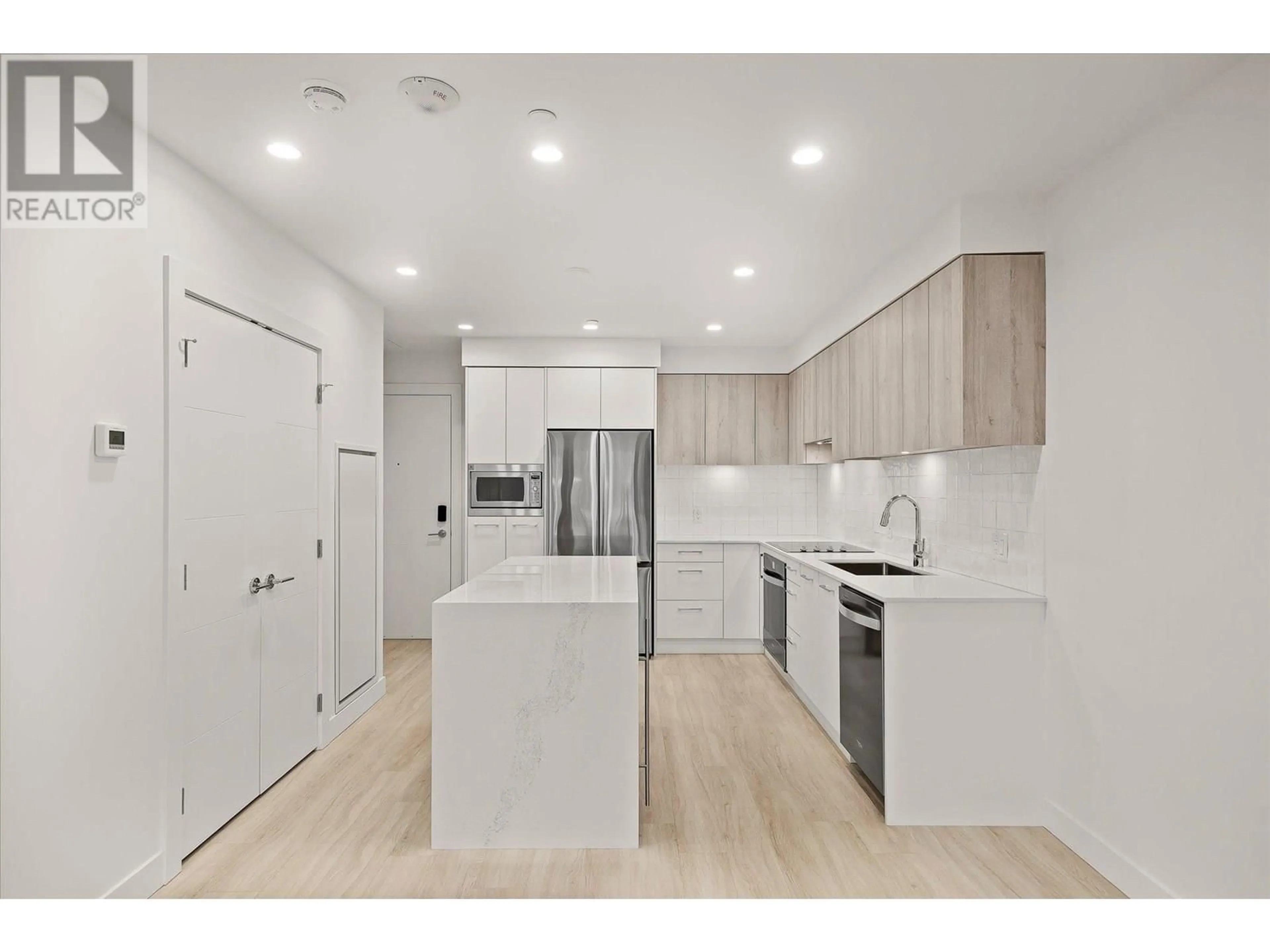 Open concept kitchen, unknown for 108 - 3699 CAPOZZI ROAD, Kelowna British Columbia V1W0G3