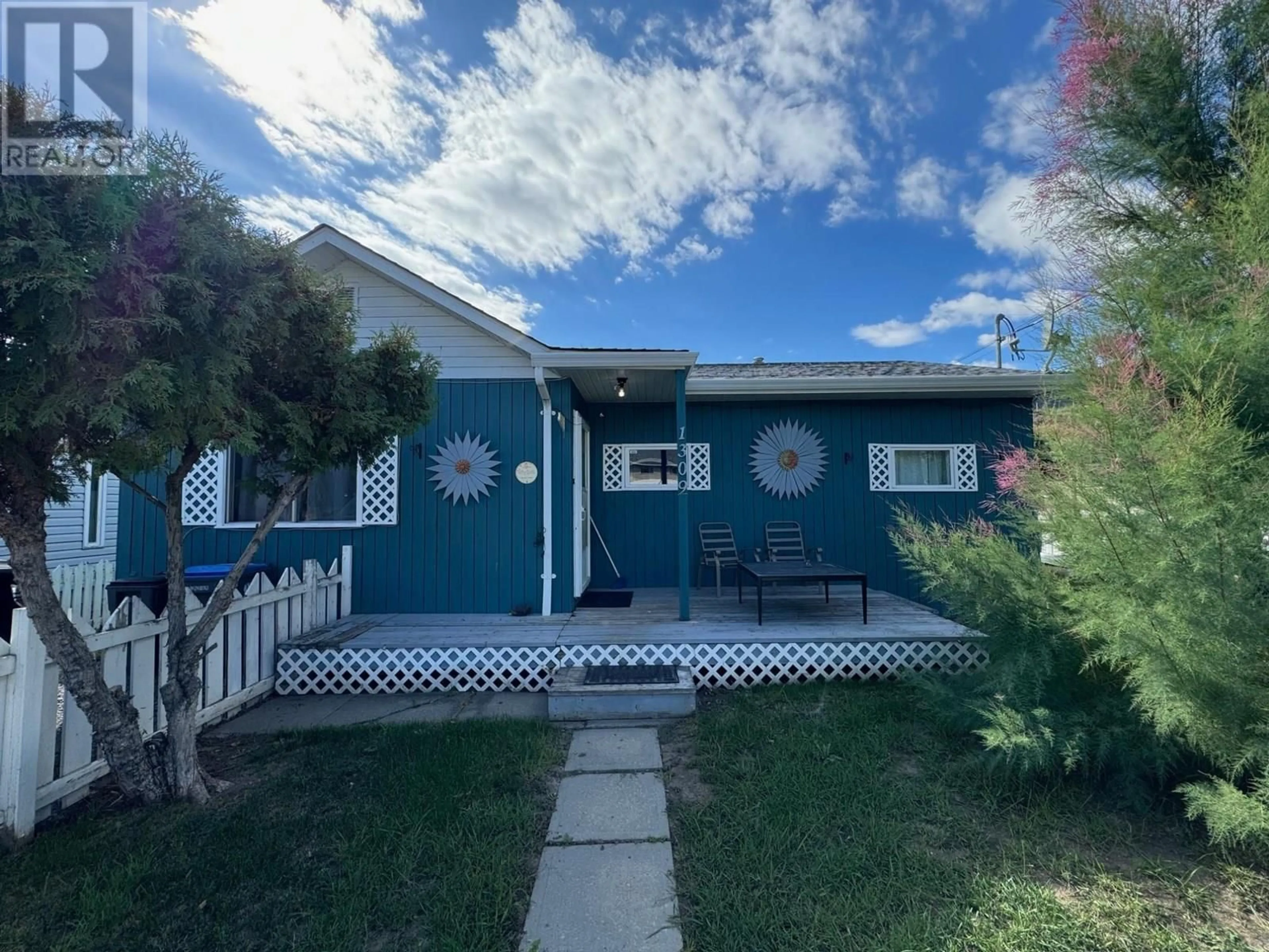 Home with vinyl exterior material, street for 1309 FIR AVENUE, Merritt British Columbia V1K1L1
