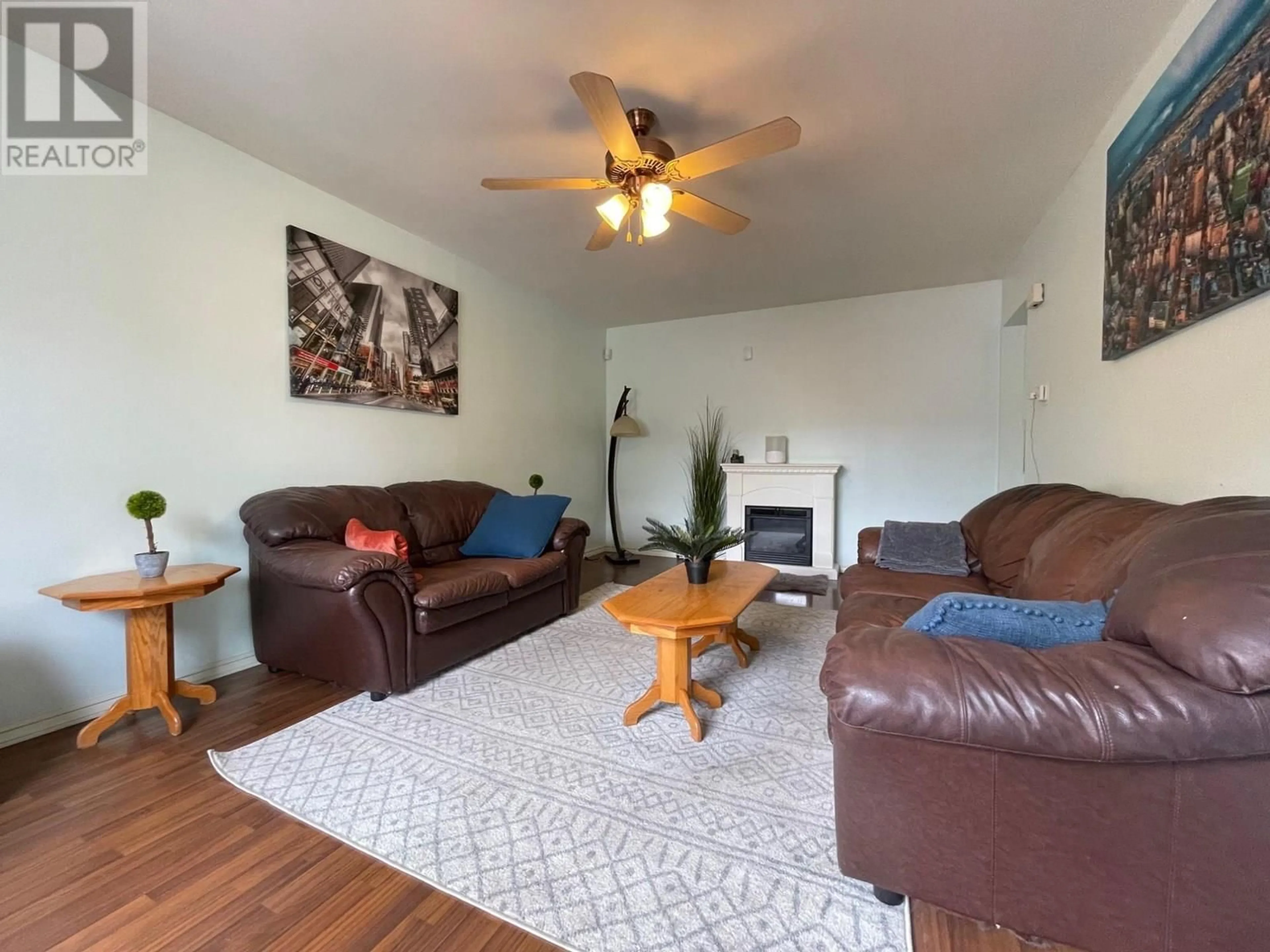 Living room with furniture, wood/laminate floor for 1309 FIR AVENUE, Merritt British Columbia V1K1L1