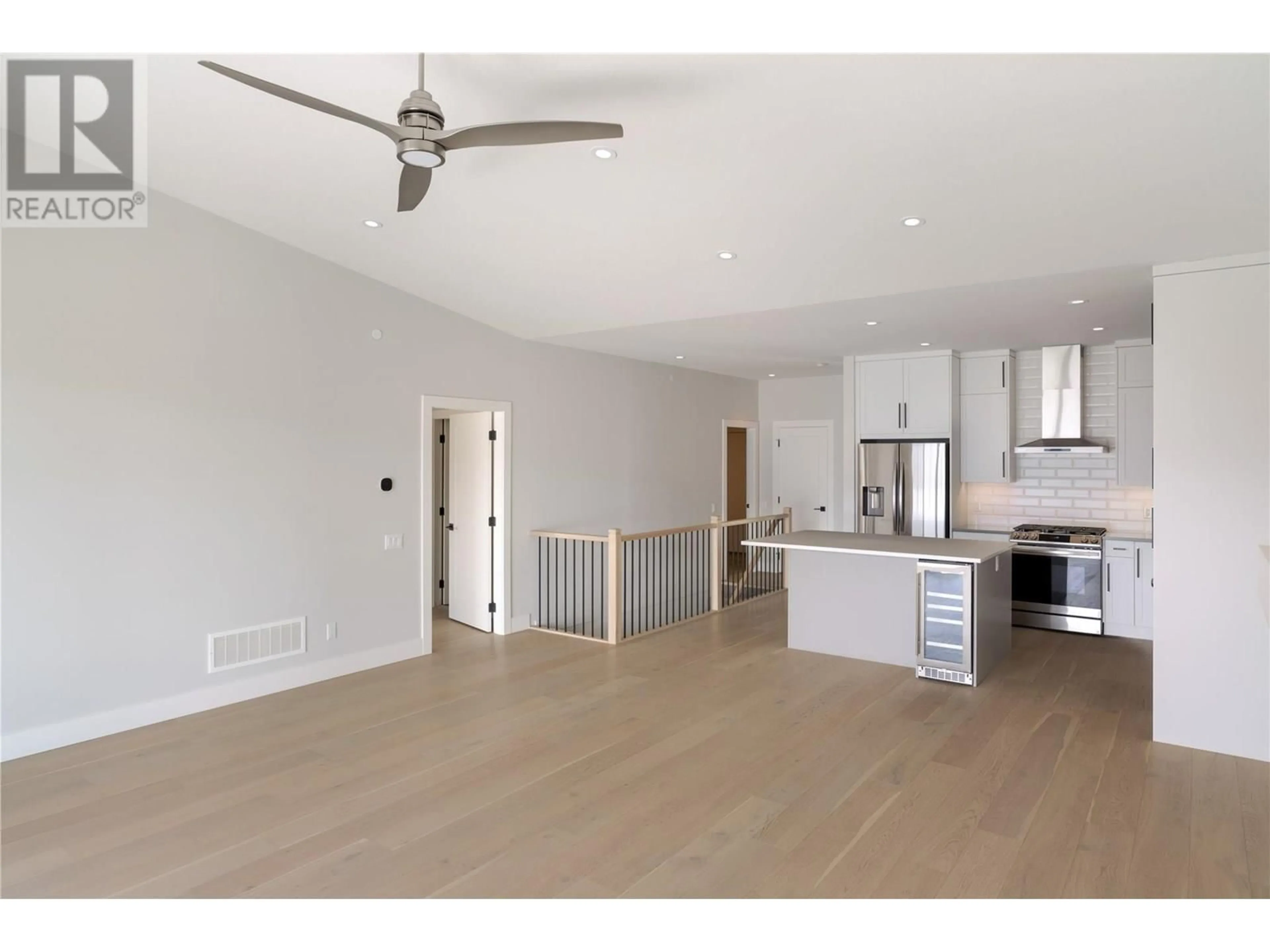 Open concept kitchen, wood/laminate floor for 3 - 10100 TYNDALL ROAD, Lake Country British Columbia V4V0A9