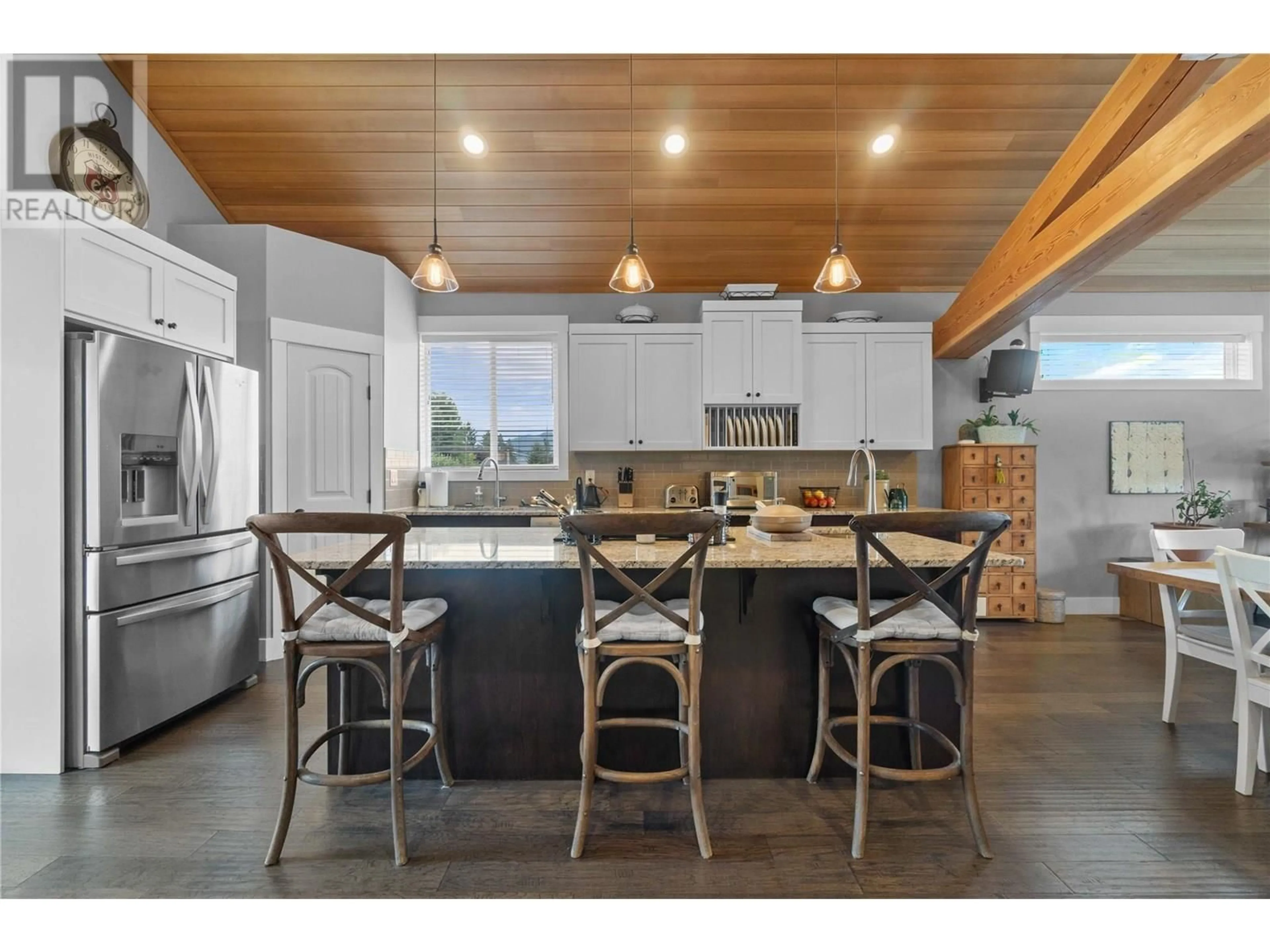 Open concept kitchen, wood/laminate floor for 2070 1 AVENUE SOUTHEAST, Salmon Arm British Columbia V1E1K1