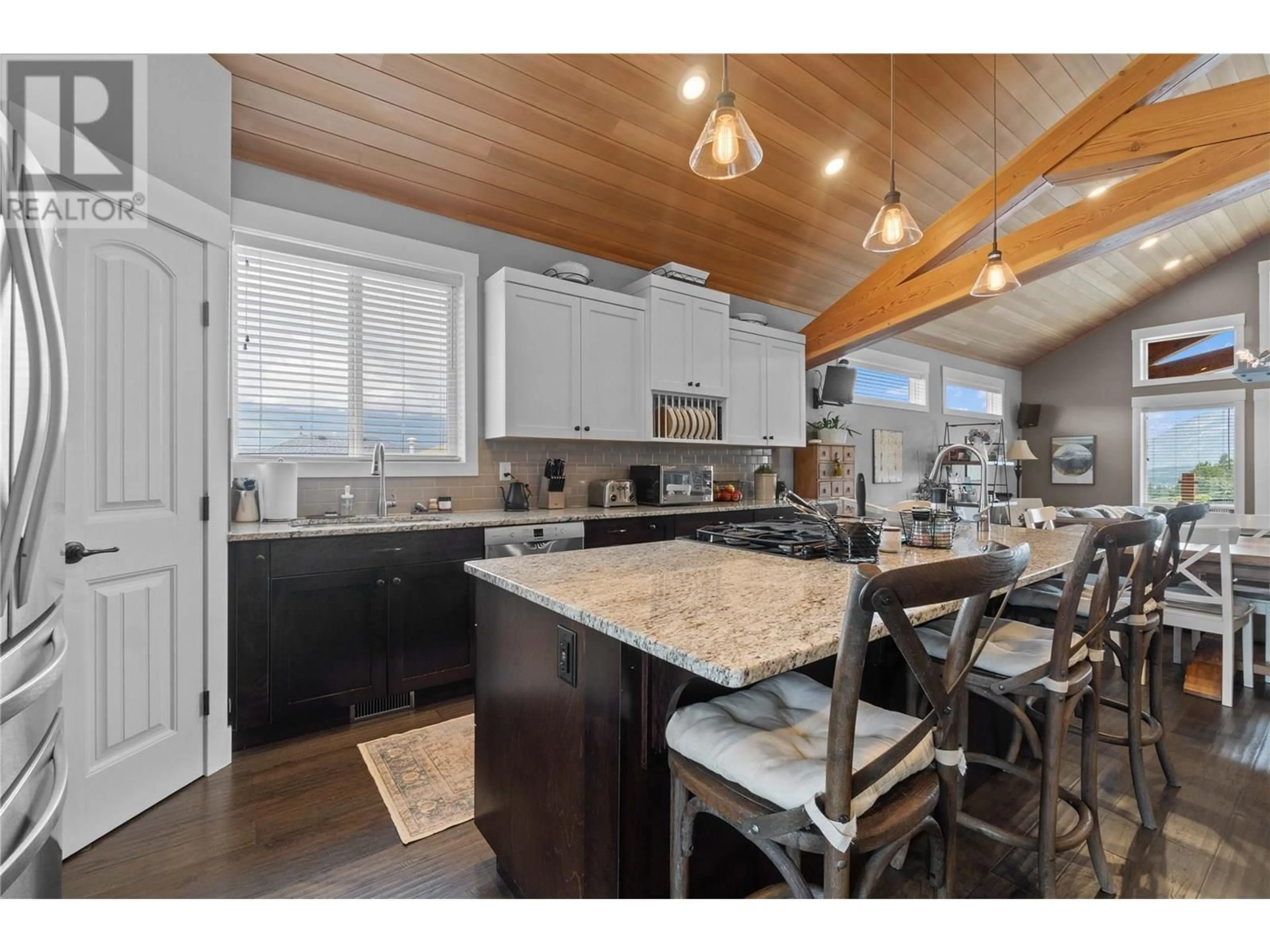 Open concept kitchen, wood/laminate floor for 2070 1 AVENUE SOUTHEAST, Salmon Arm British Columbia V1E1K1