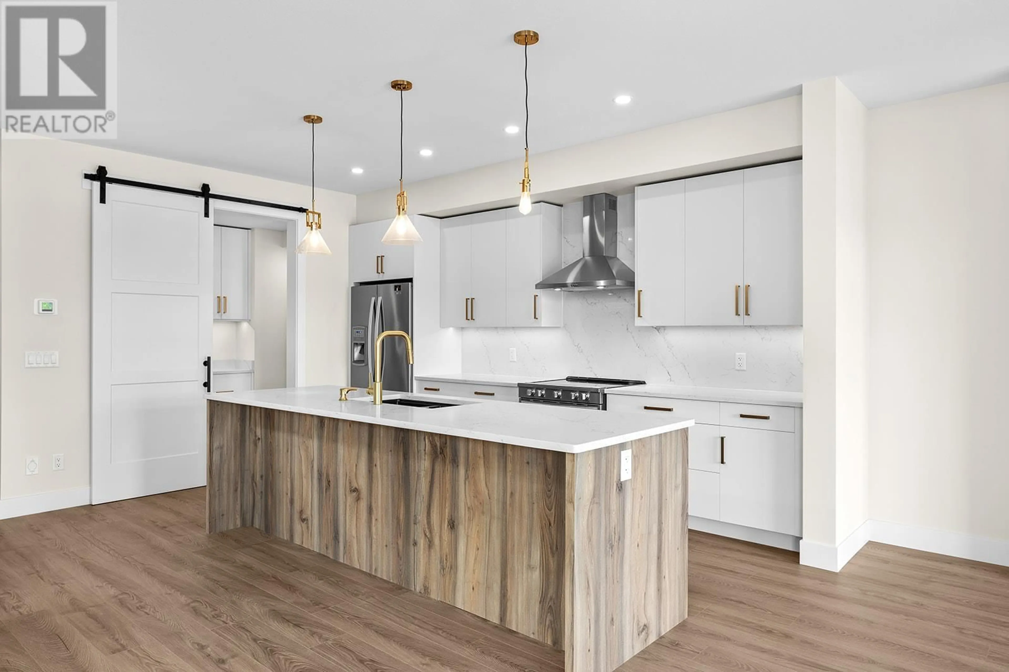 Open concept kitchen, wood/laminate floor for 1023 KITSON COURT, West Kelowna British Columbia V1Z2G7