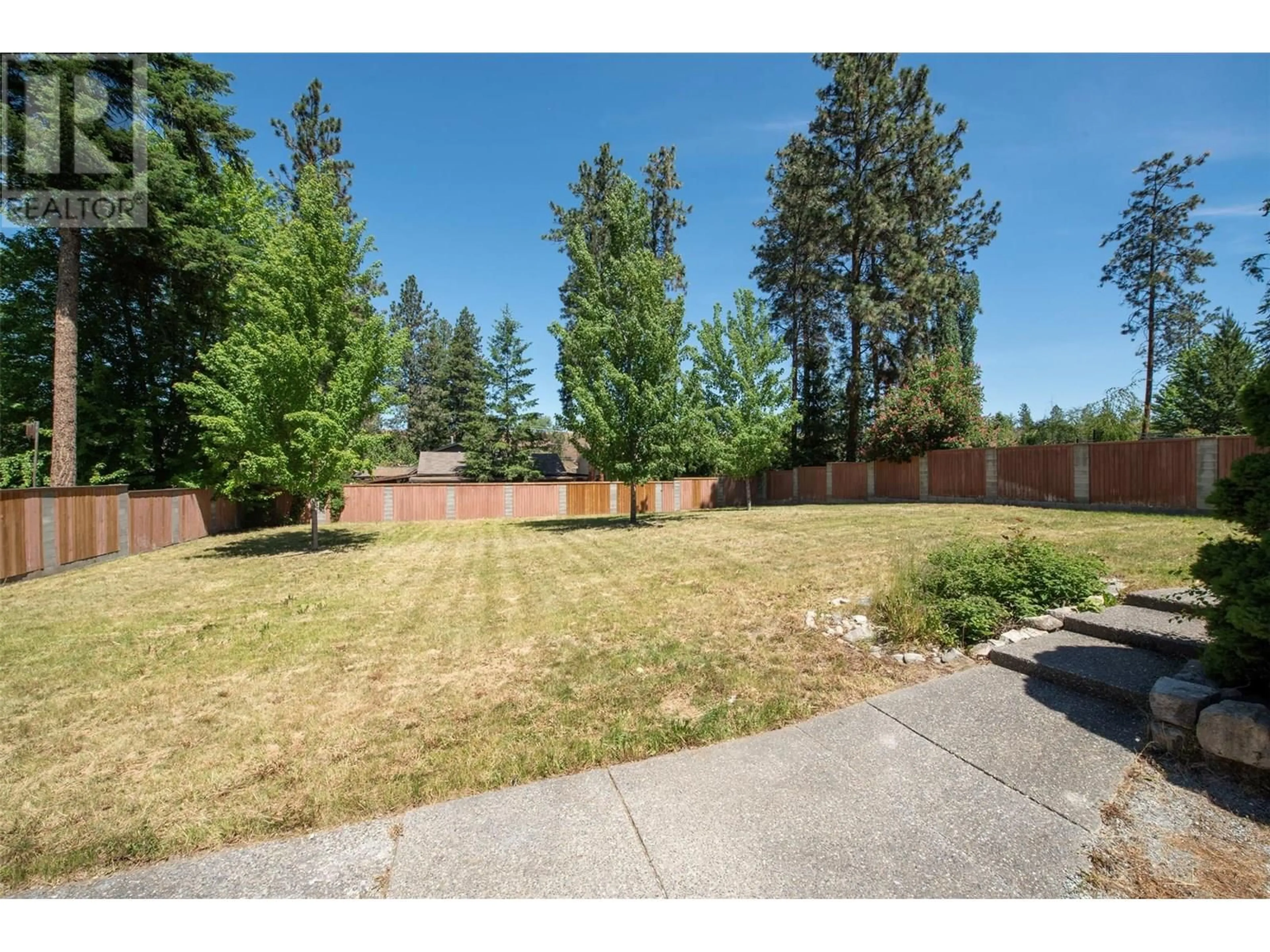 A pic from outside/outdoor area/front of a property/back of a property/a pic from drone, street for 1440 MISSION RIDGE DRIVE, Kelowna British Columbia V1W3B1