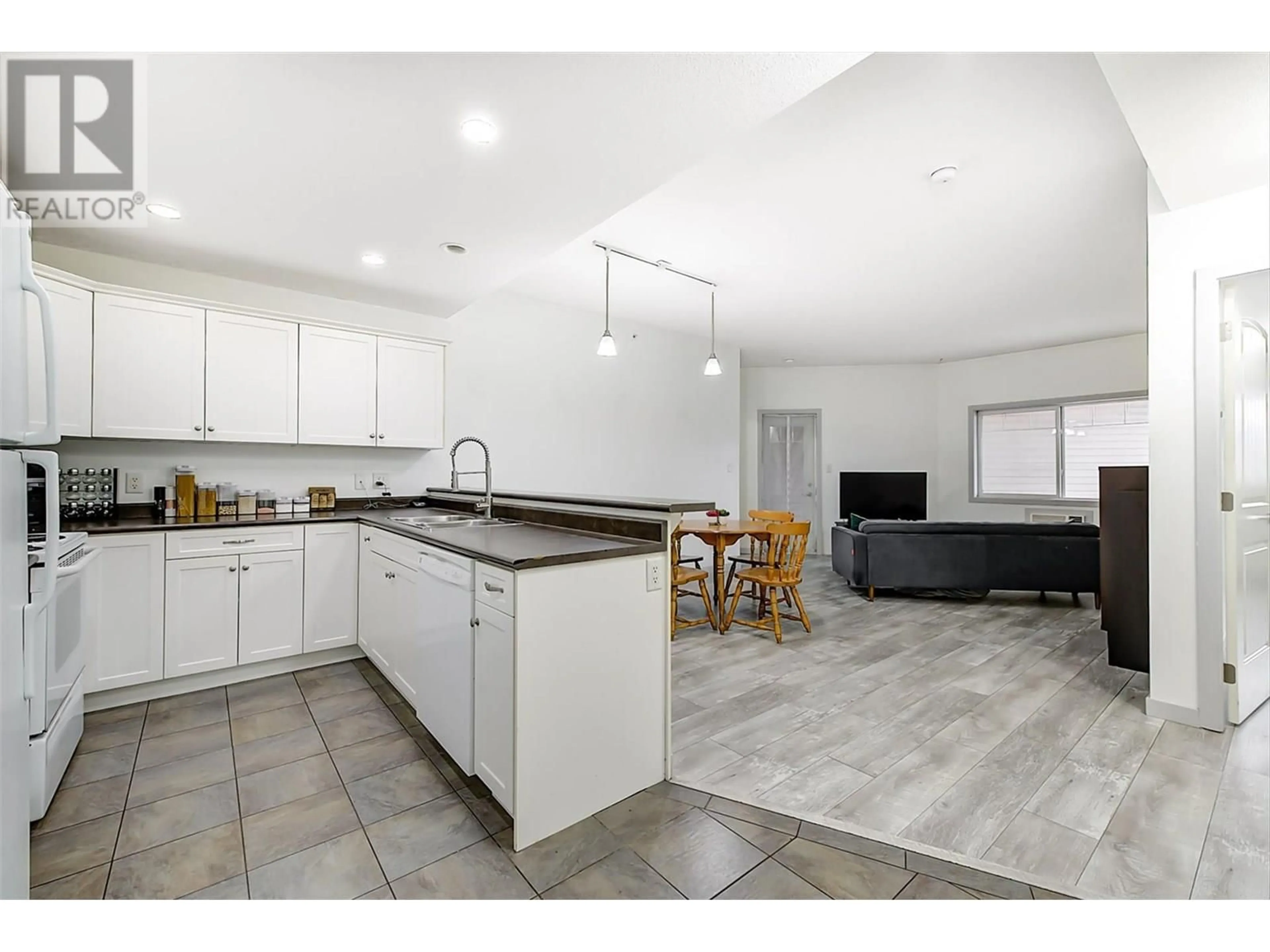 Open concept kitchen, ceramic/tile floor for 305 - 345 MILLS ROAD, Kelowna British Columbia V1X4G9