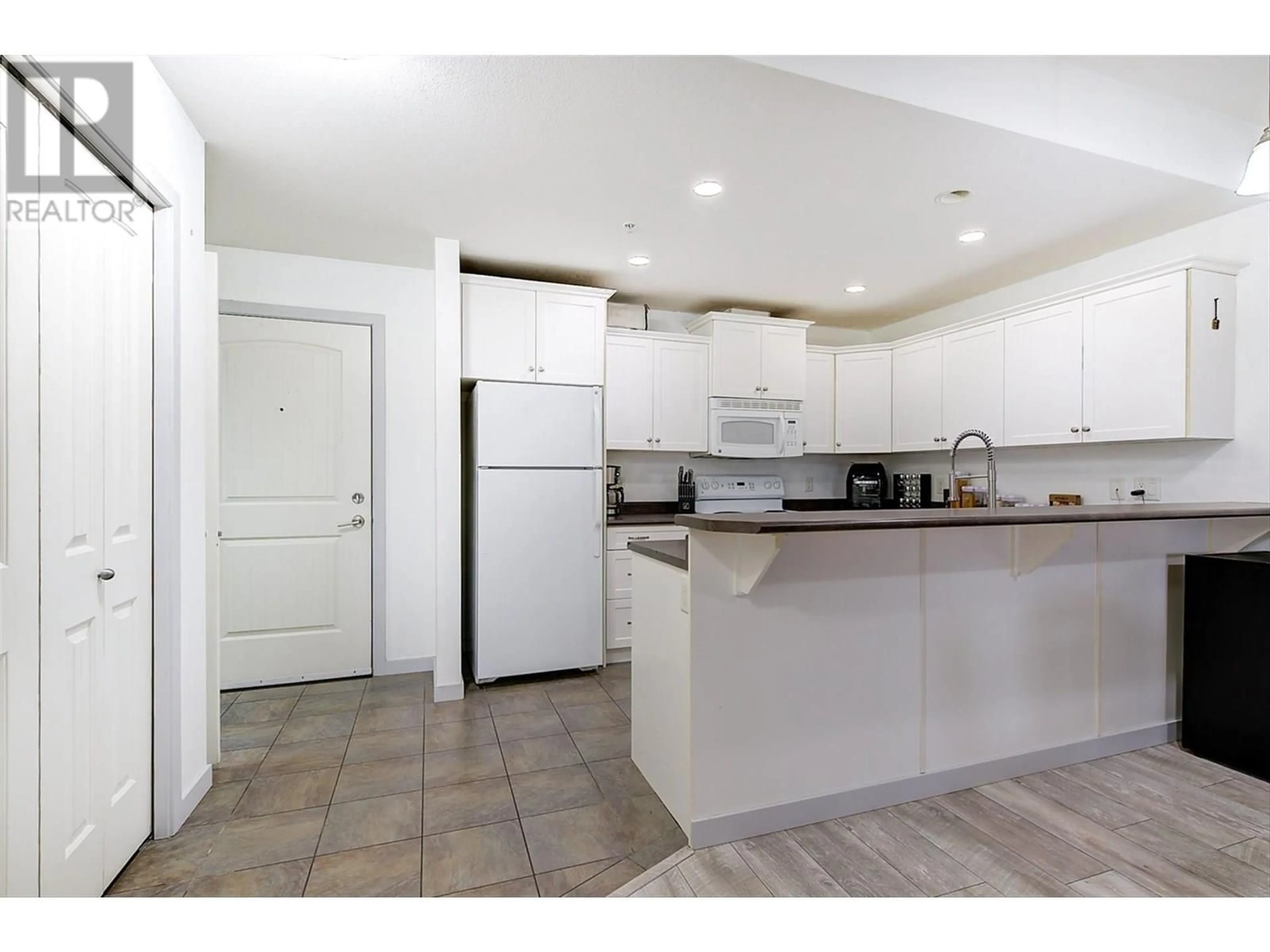 Standard kitchen, ceramic/tile floor for 305 - 345 MILLS ROAD, Kelowna British Columbia V1X4G9