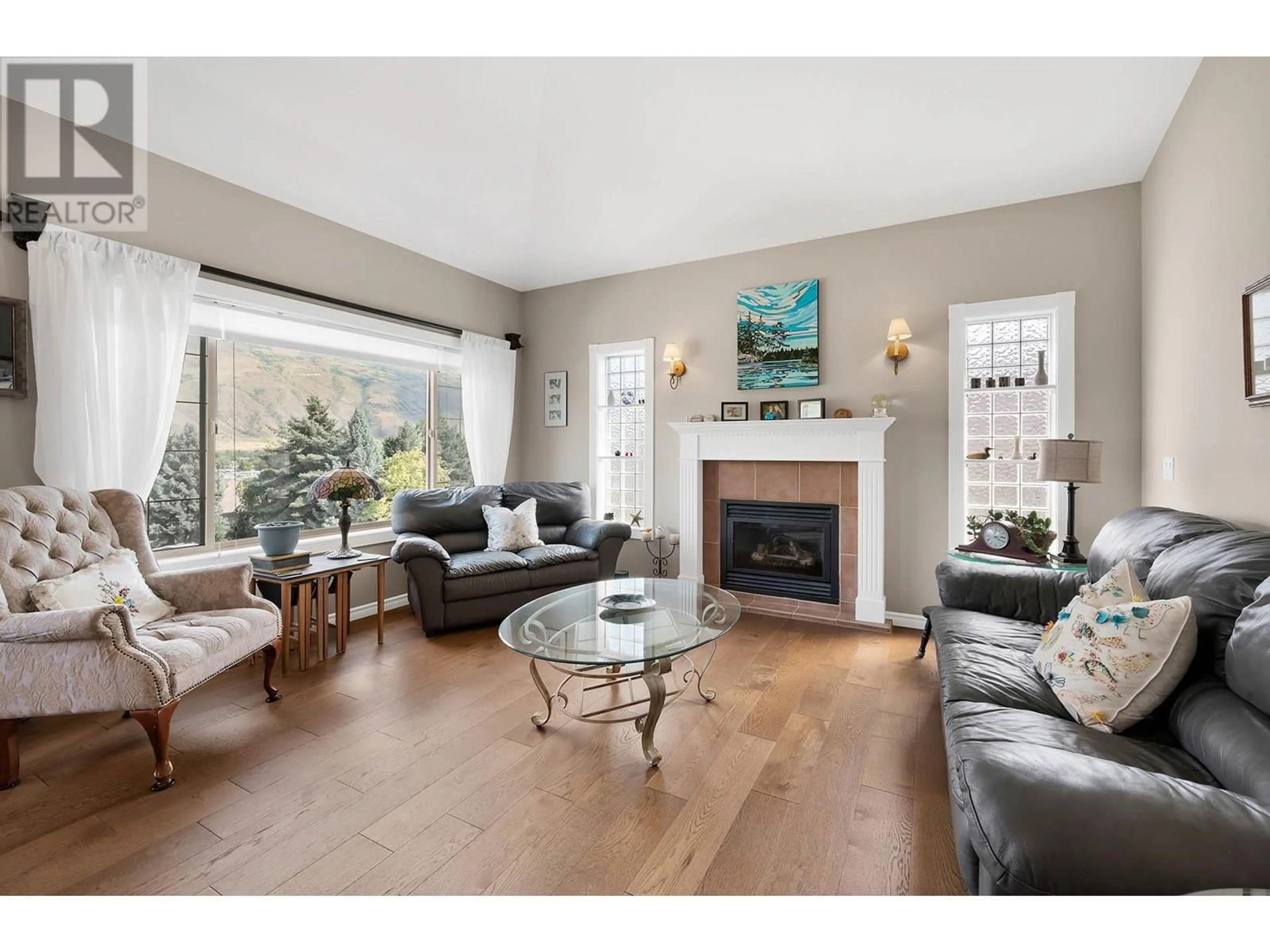 Living room with furniture, wood/laminate floor for 996 PINE SPRINGS ROAD, Kamloops British Columbia V2B8H2