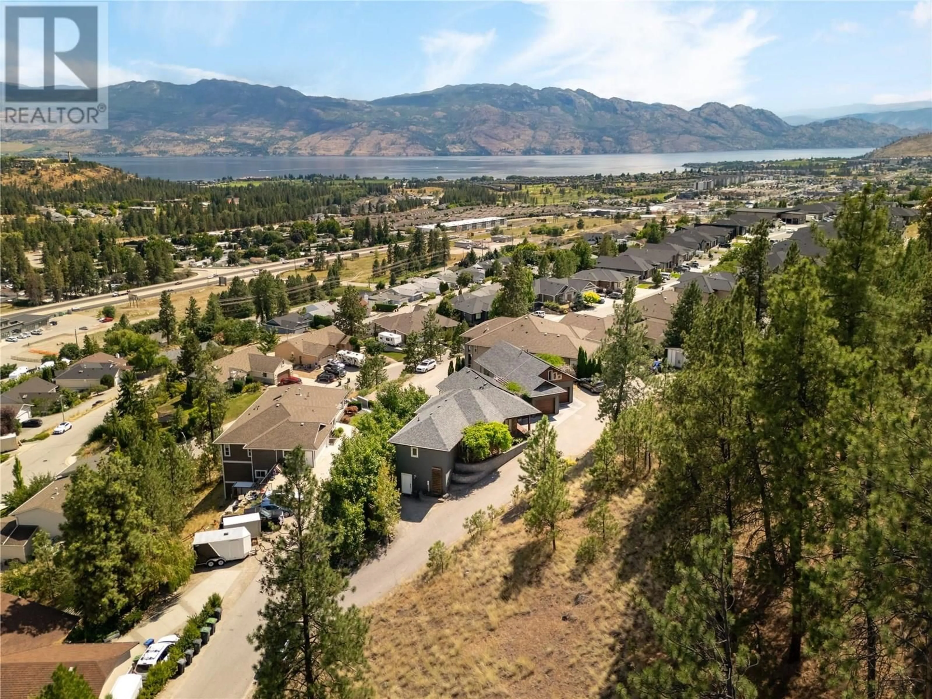 A pic from outside/outdoor area/front of a property/back of a property/a pic from drone, mountain view for 3025 ENSIGN LANE, West Kelowna British Columbia V4T2Z4