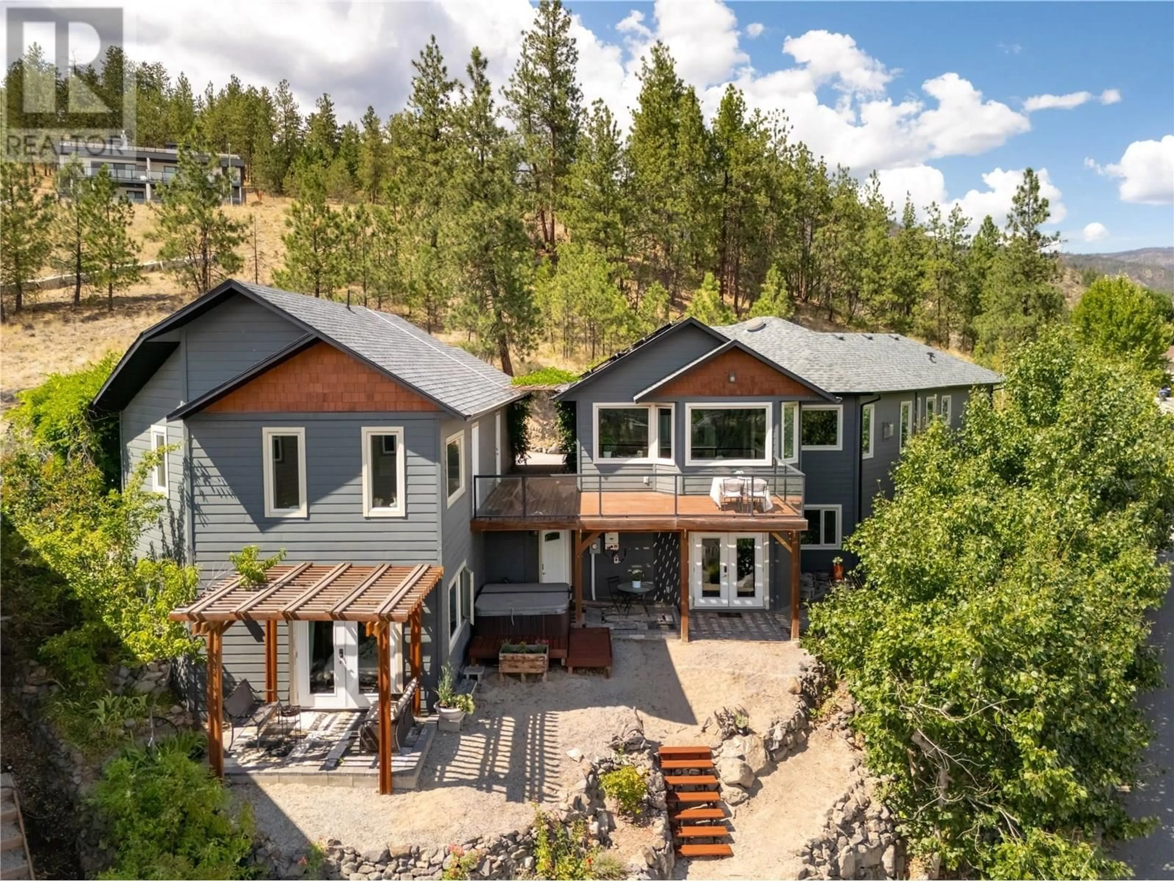 A pic from outside/outdoor area/front of a property/back of a property/a pic from drone, mountain view for 3025 ENSIGN LANE, West Kelowna British Columbia V4T2Z4