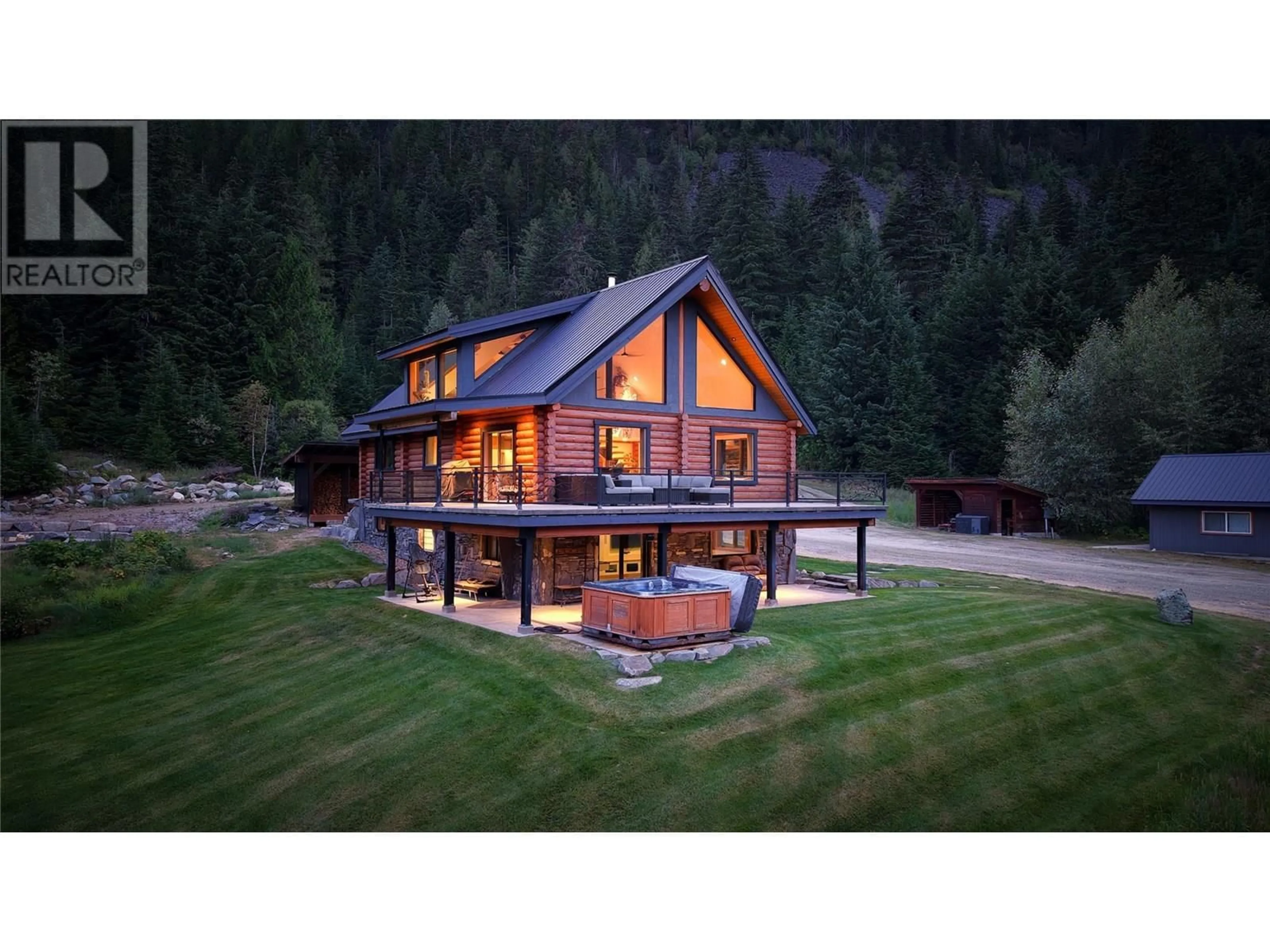 Home with vinyl exterior material, mountain view for 6580 6 HIGHWAY, Ymir British Columbia V0G2K0